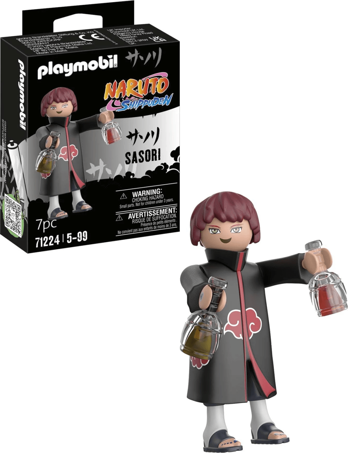 Figura de Playmobil Sasori con pelo rojo y abrigo negro sosteniendo frascos, frente a su caja de embalaje.