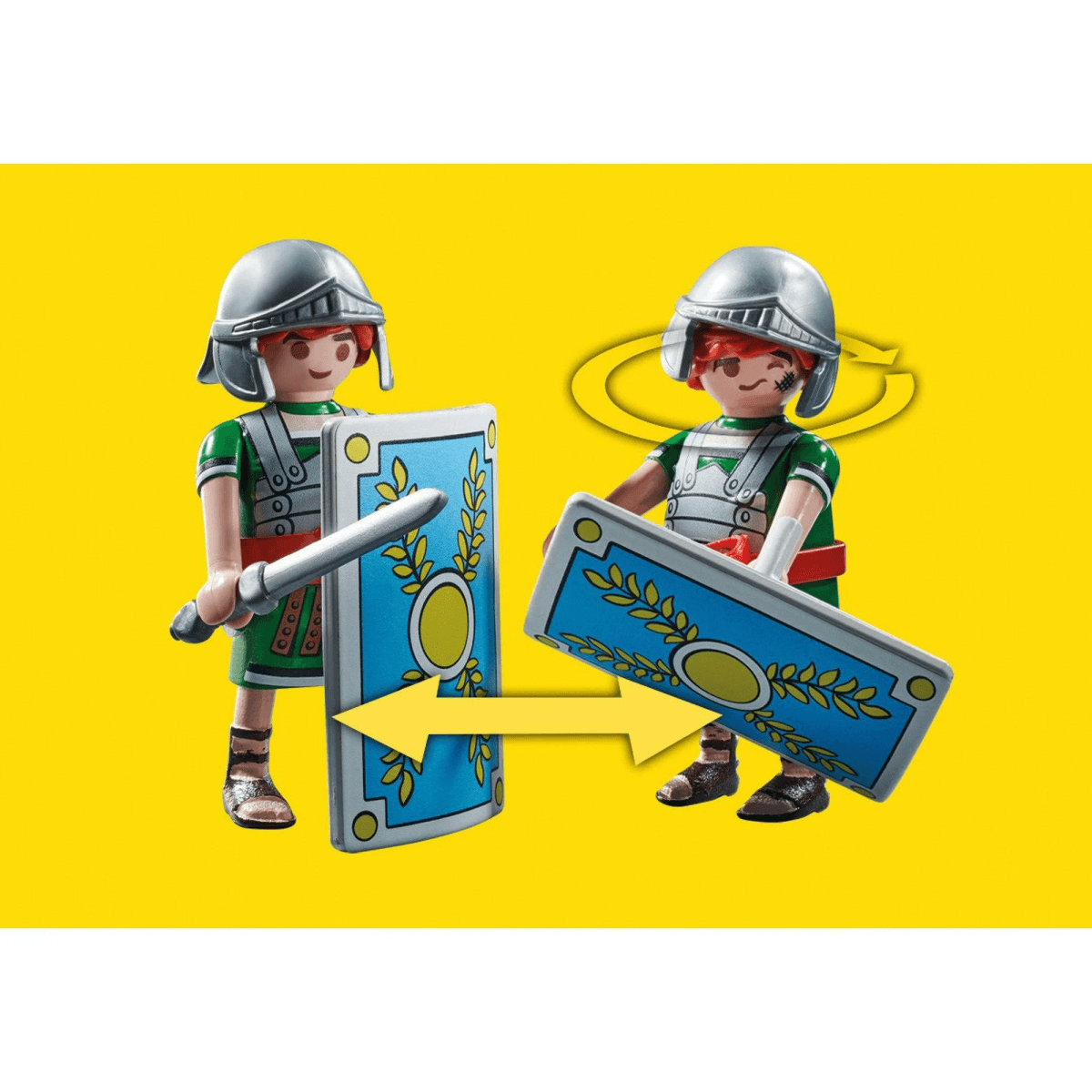 Zwei Playmobil-Römische-Soldaten-Figuren demonstrieren Drehbewegungen mit Schildern auf gelbem Hintergrund.