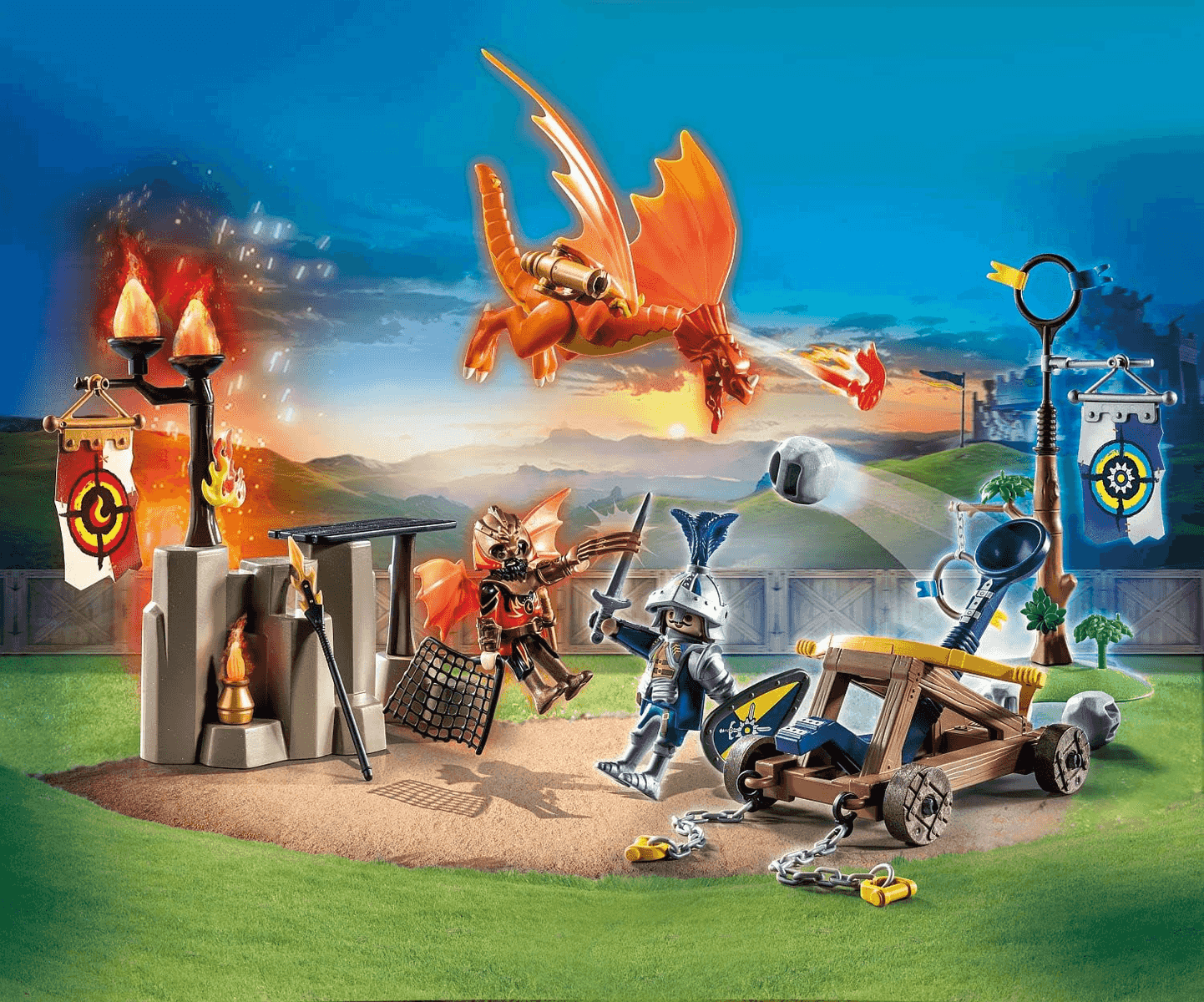 Set de juego Playmobil con un caballero usando un cañón y un dragón volando.