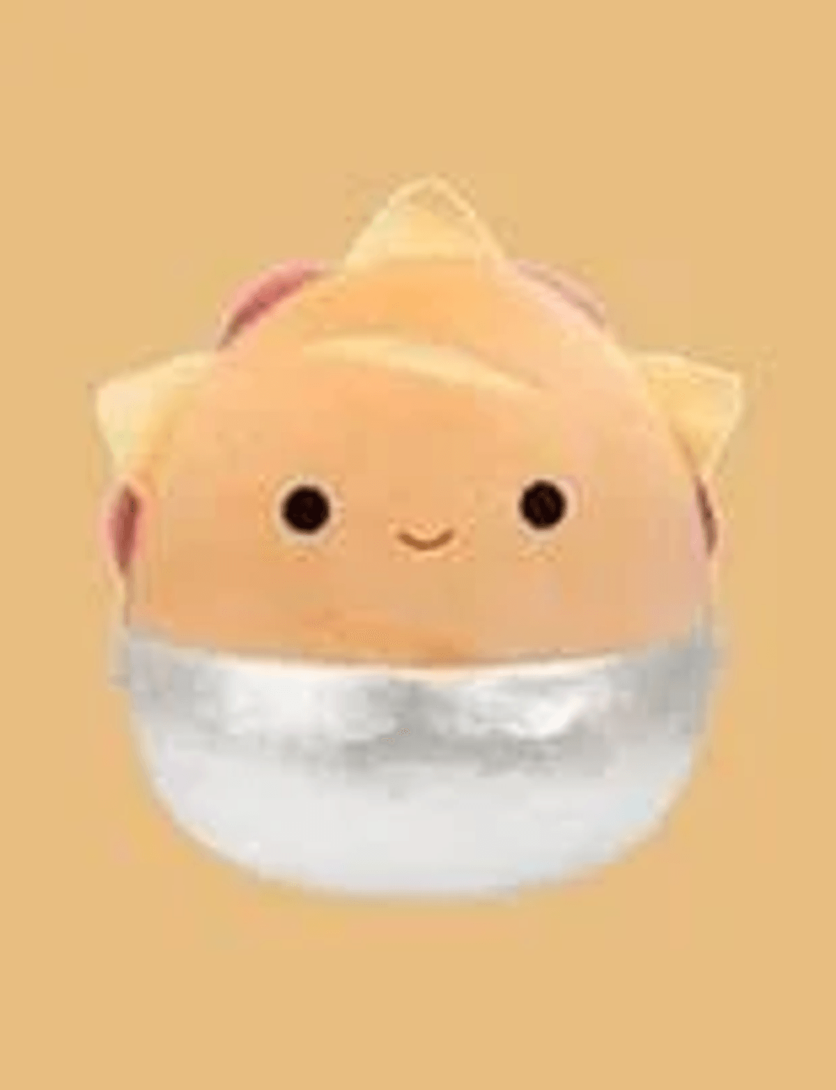 Un pastel de sol de peluche redondo y beige con cara amable sobre fondo beige.