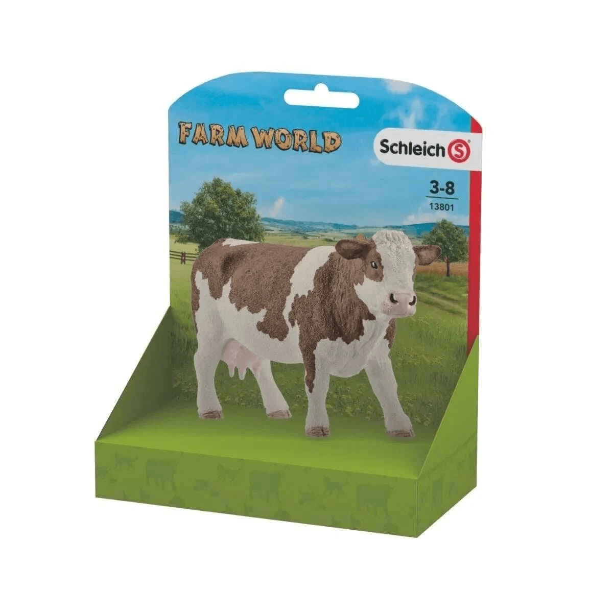 Eine braun-weiße Schleich-Kuhfigur in einer grünen Farm-World-Verpackung.