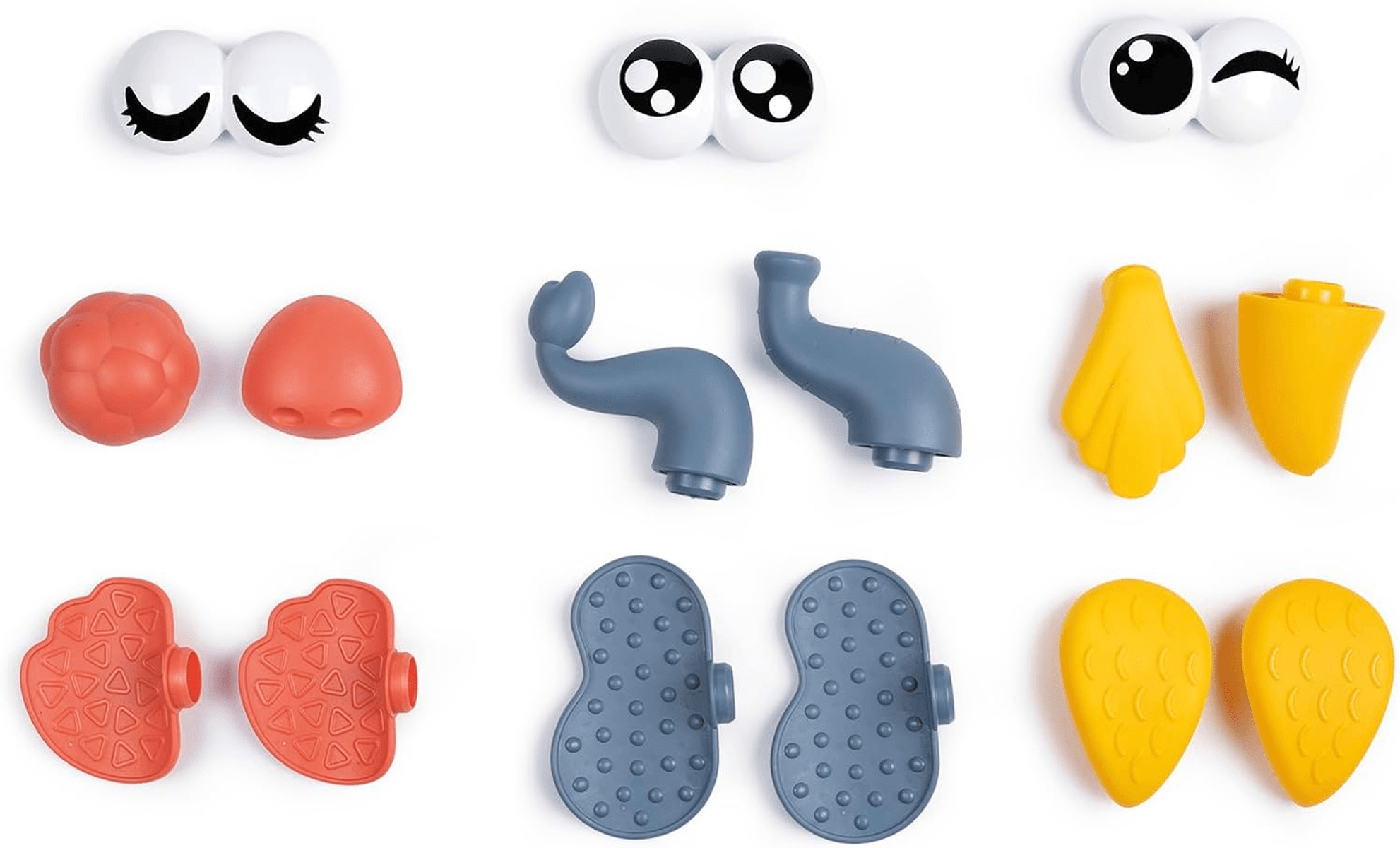 Varias piezas de plástico de colores para juguetes infantiles, incluidos ojos, extremidades y partes del cuerpo.