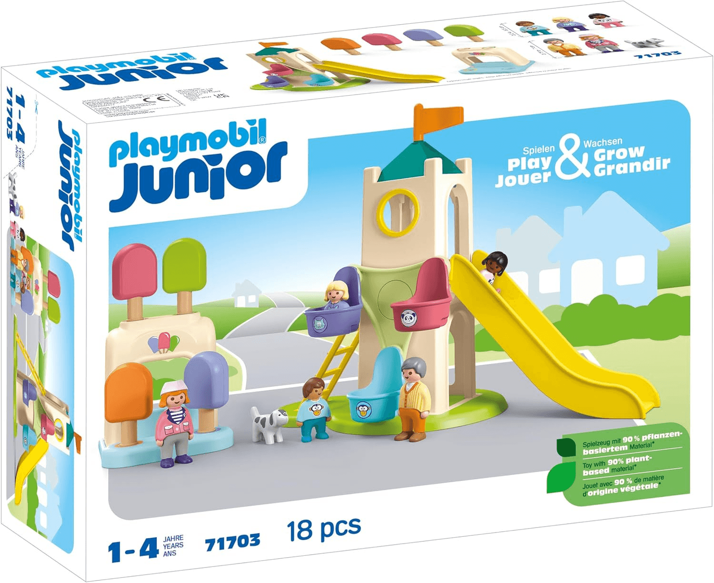 Set de juego Playmobil Junior con torre, tobogán, figuras y perro frente a un paisaje.
