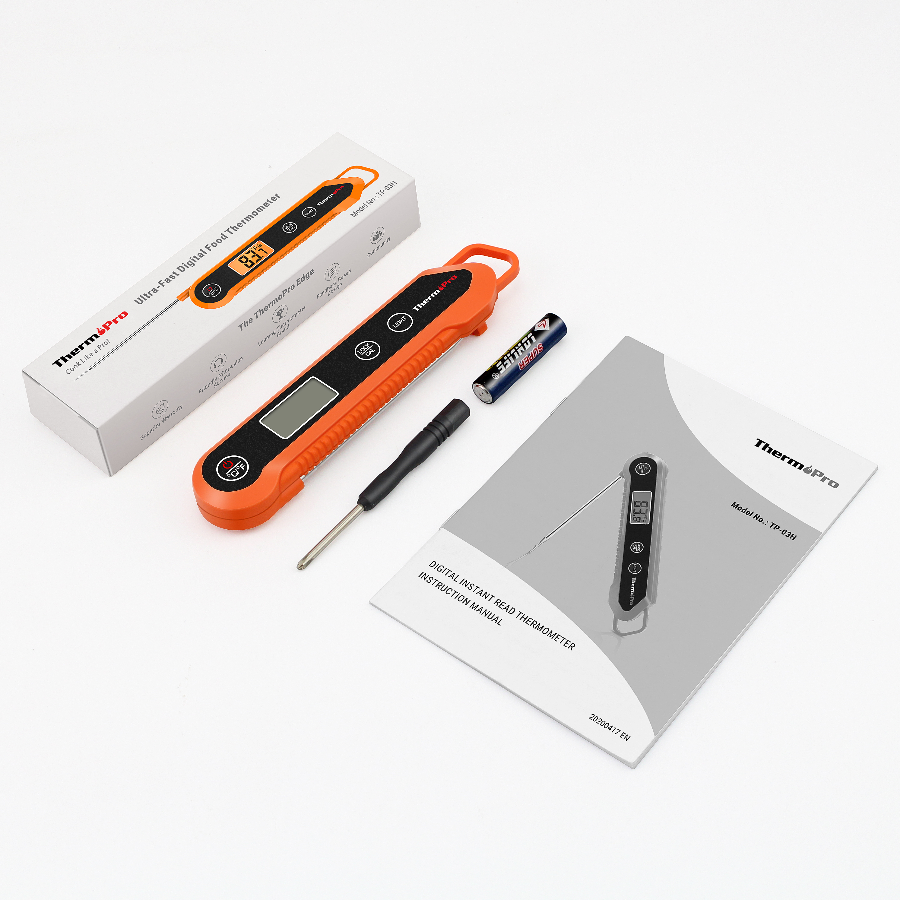 Ein orangefarbenes Fleischthermometer mit Box, Anleitung, Batterie und Schraubendreher.
