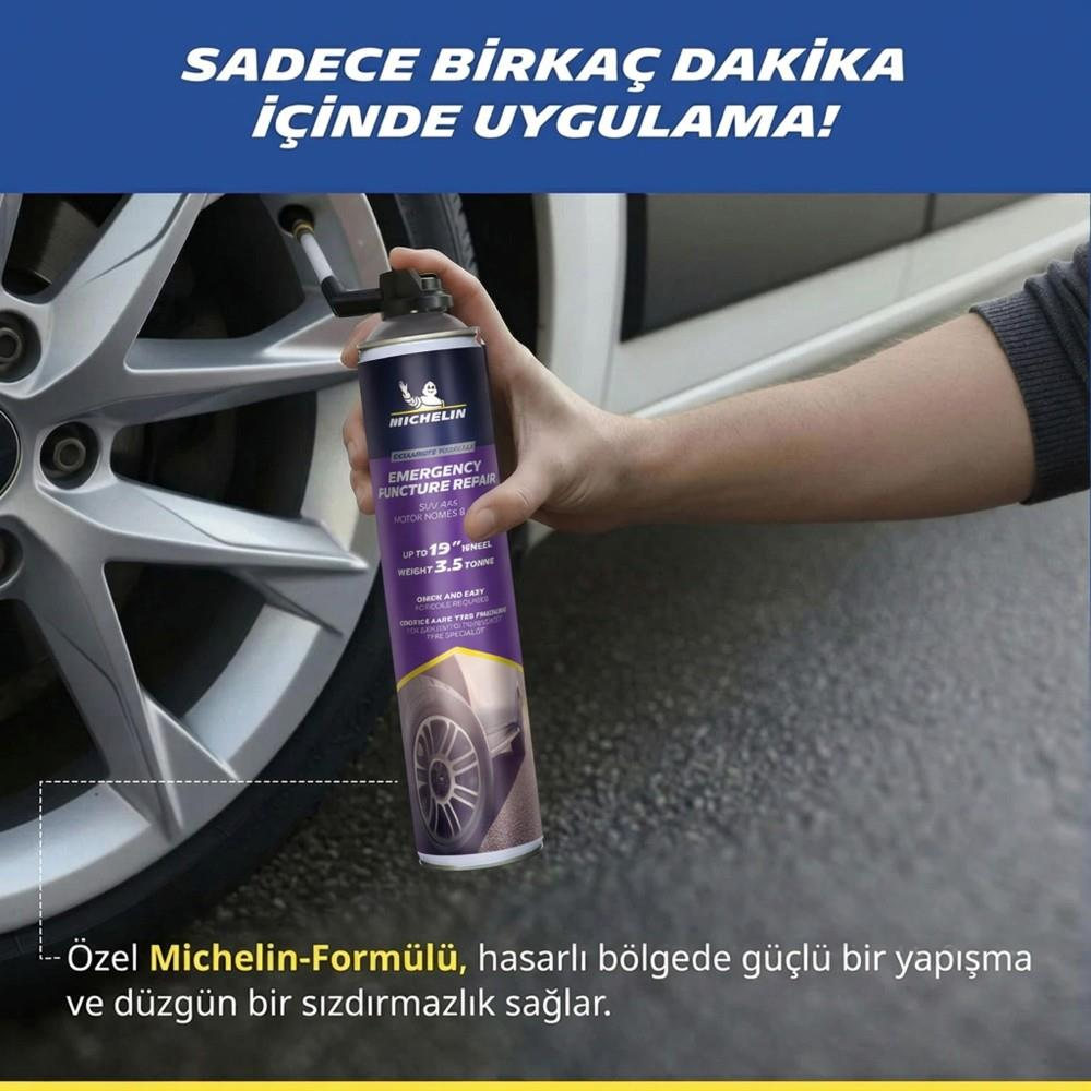 Bir el otomobil lastiğine Michelin acil durum tamir spreyi sıkıyor.