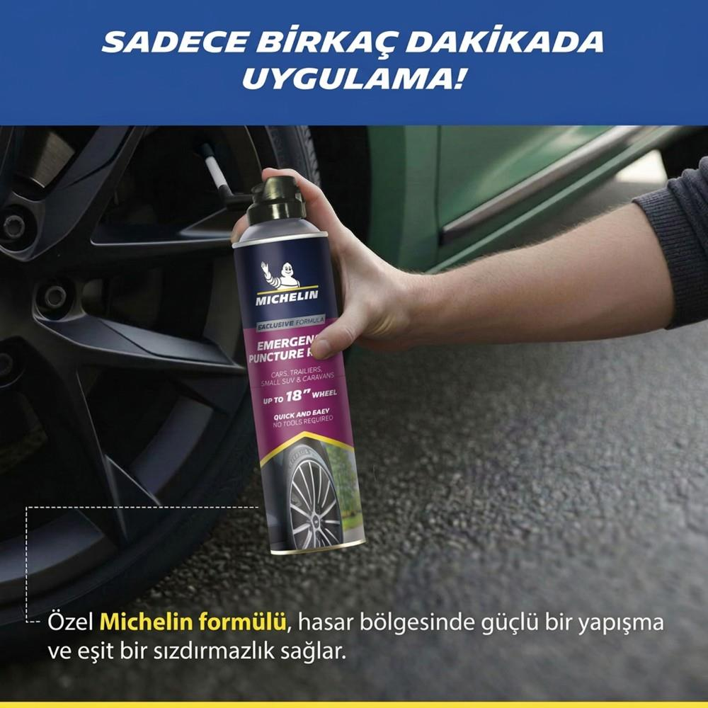 Bir kişi araba lastiğine Michelin patlak tamir spreyi sıkıyor.