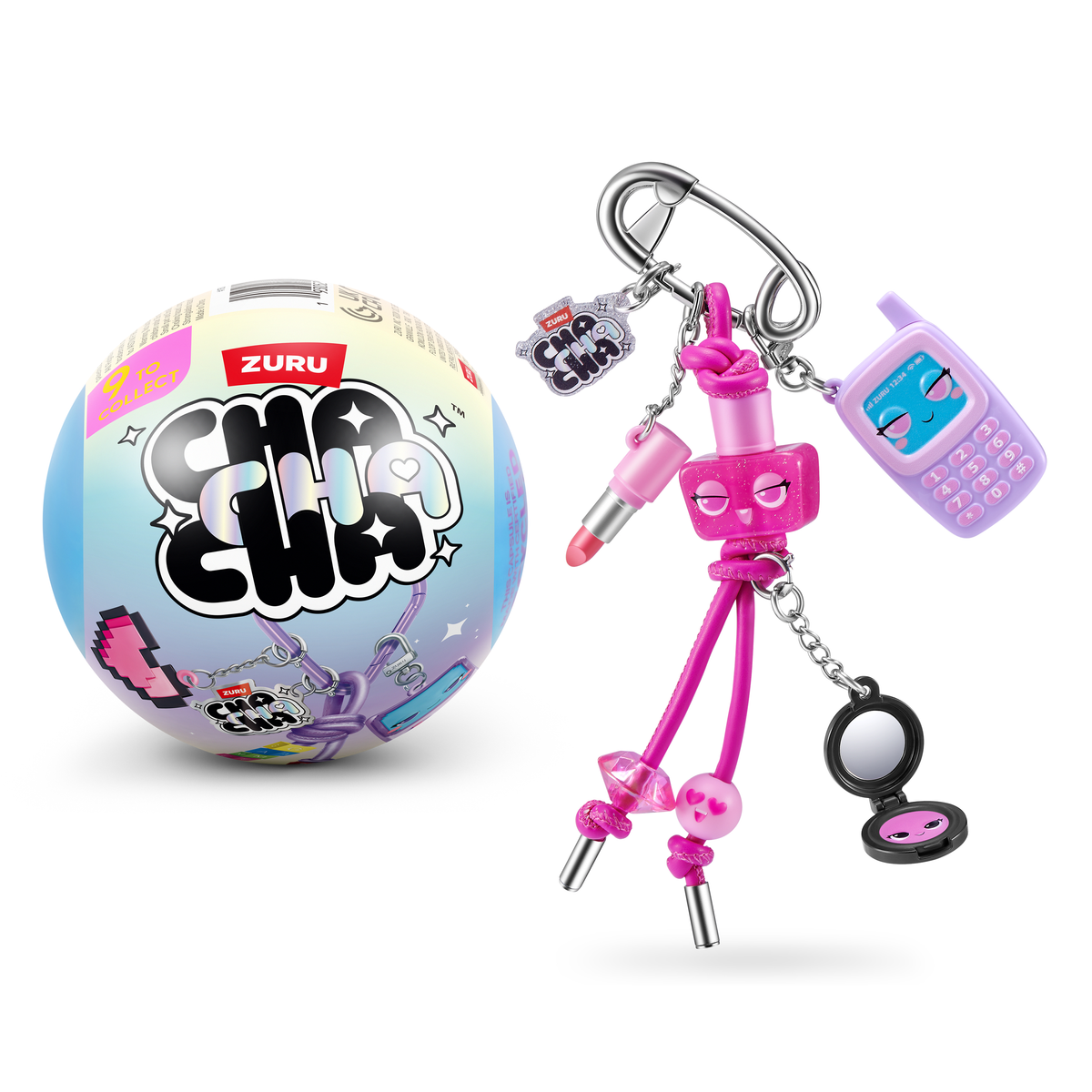 Una cápsula sorpresa Zuru Cha Cha Cha y llavero rosa a juego con dijes sobre un fondo blanco.