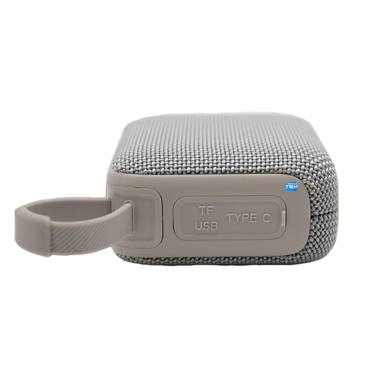 Altoparlante compatto grigio con rivestimento in tessuto, maniglia e porta USB-C coperta.