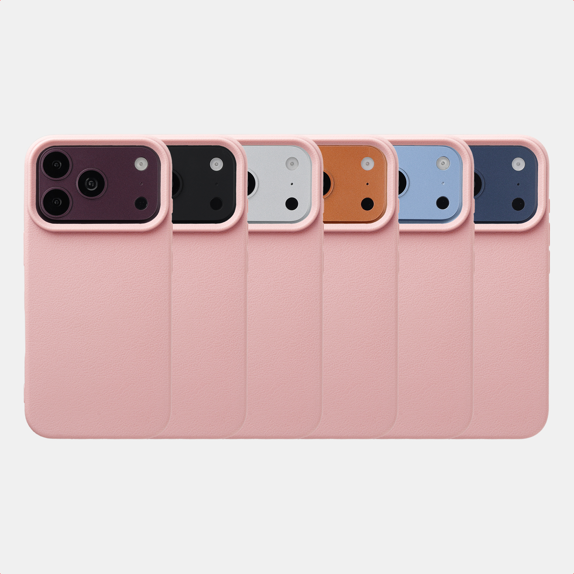Sechs rosa Smartphones mit unterschiedlichen Kamerafarben in einer Reihe vor neutralem Hintergrund.