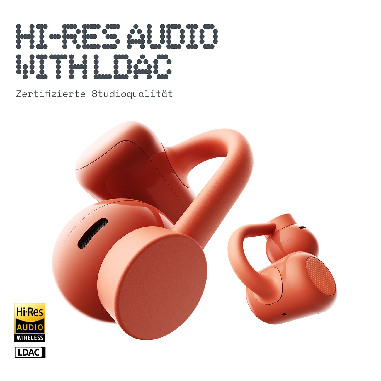 Zwei orangefarbene kabellose Ohrhörer mit Hi-Res Audio LDAC Logo vor weißem Hintergrund.