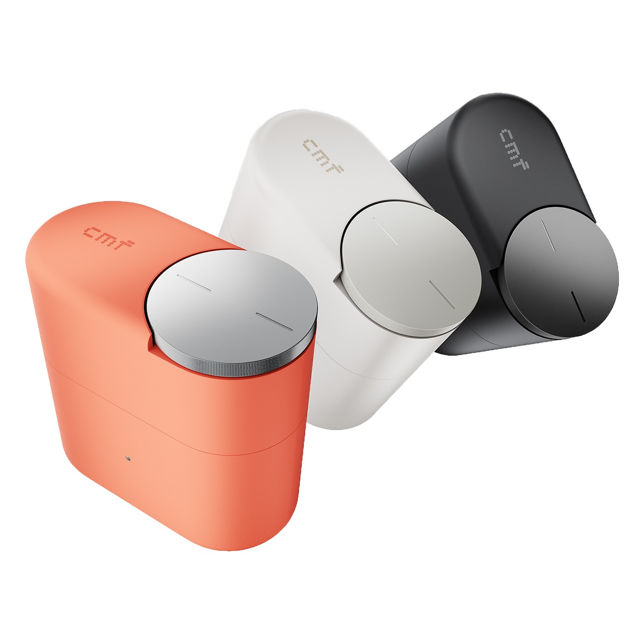 Drei CMF-Geräte in Orange, Weiß und Schwarz mit runden Metallknöpfen.
