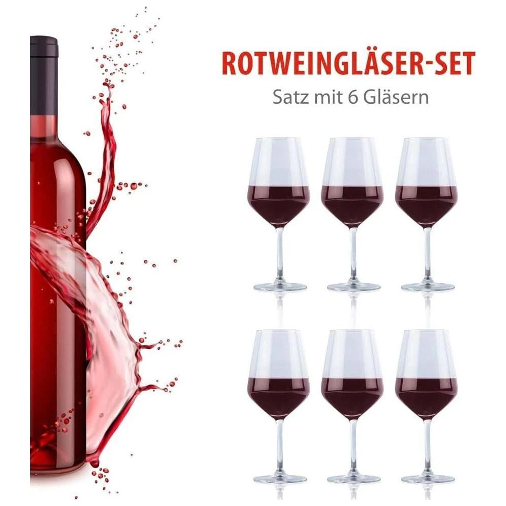 Rode wijnglas set met zes glazen en een wijnfles met rode wijnspat.