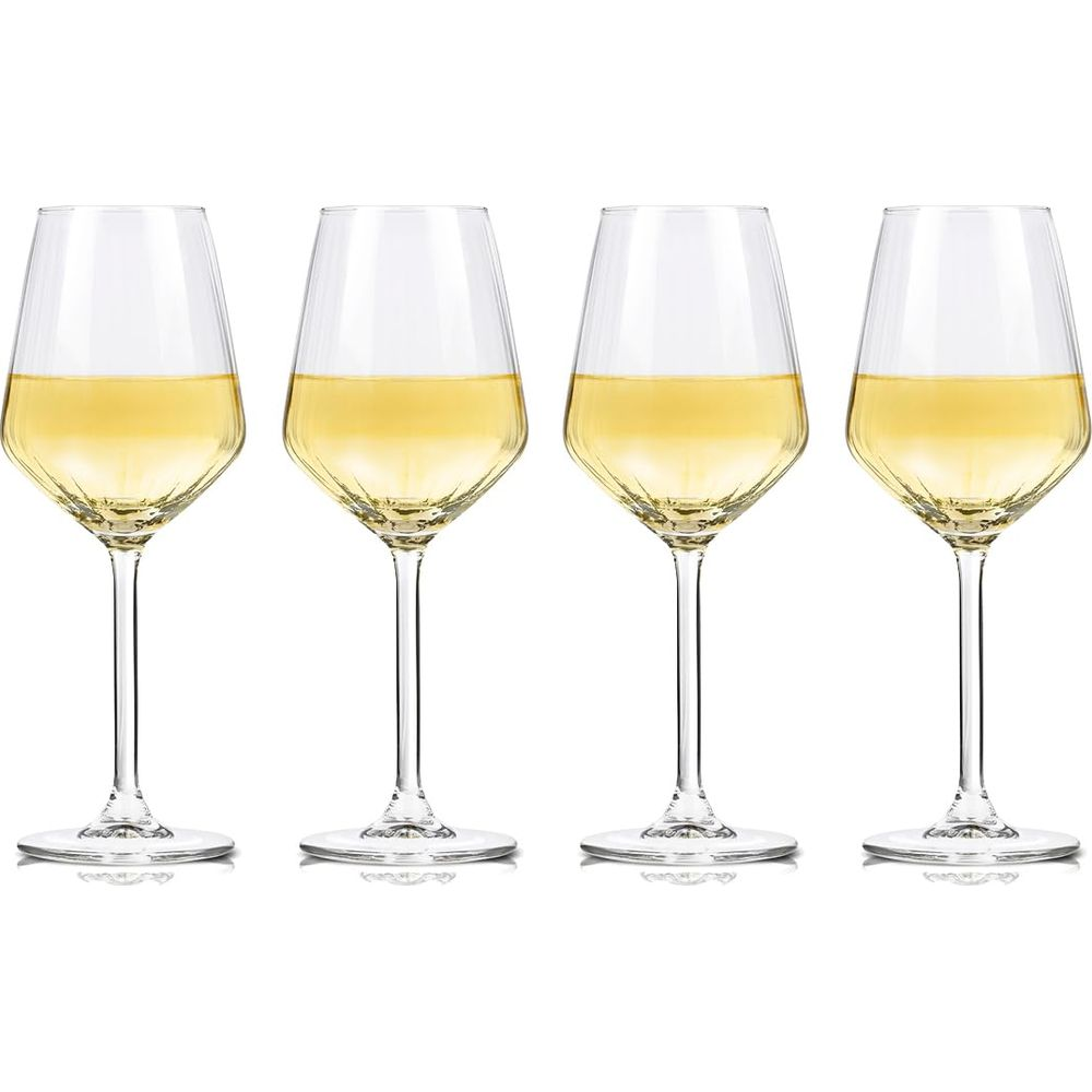 Four elegant white wine glasses with faceted bowls and yellow wine on a white background.