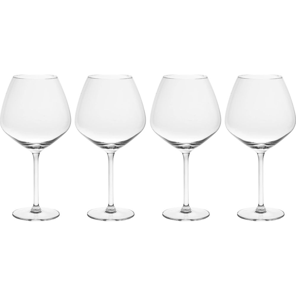 Four transparent wine glasses with rounded bowls stand in a row against a white background.