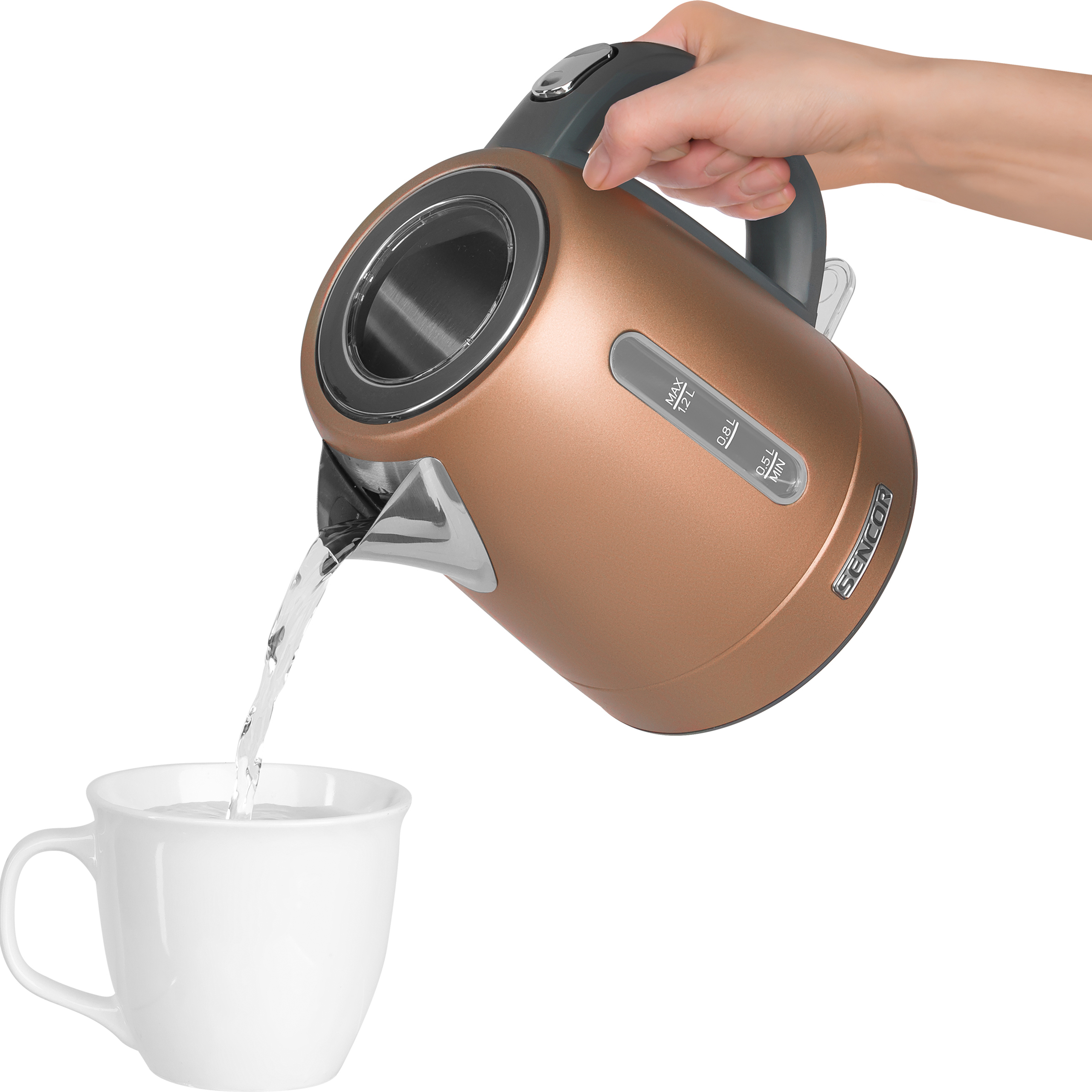 A hand pours water from a copper-colored electric kettle into a white mug.