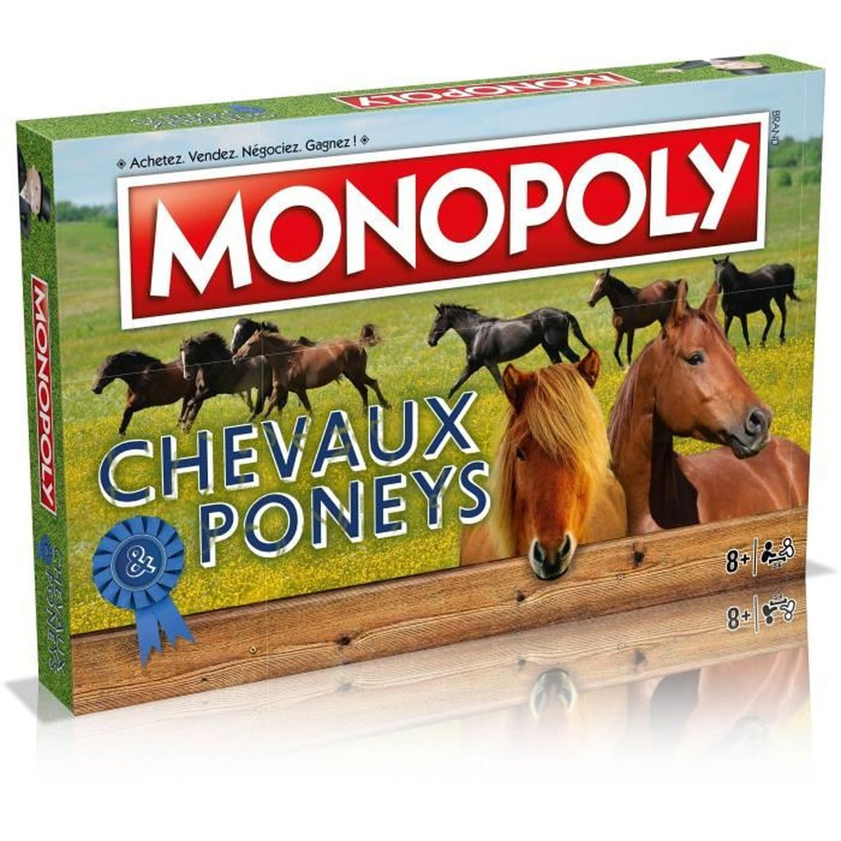 Monopoly Chevaux & Poneys Brettspielkarton mit Pferden auf einer grünen Wiese.