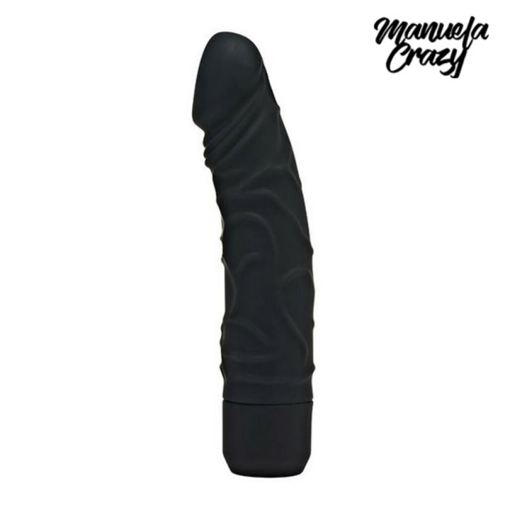 Ein schwarzer, texturierter Dildo steht vertikal vor weißem Hintergrund, mit dem Text Manuela Crazy oben rechts.