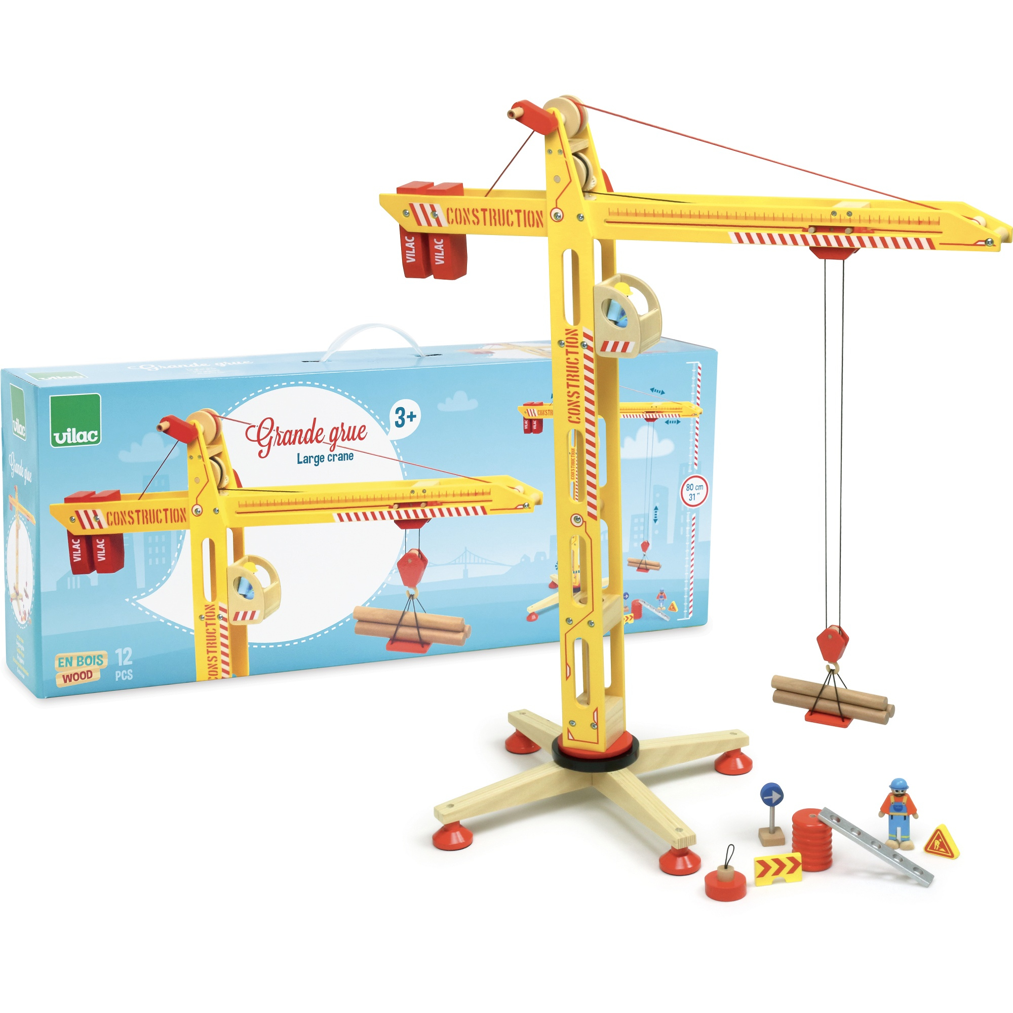 Gelber Holzspielzeugkran mit Bauteilen und Verpackung auf weißem Grund.