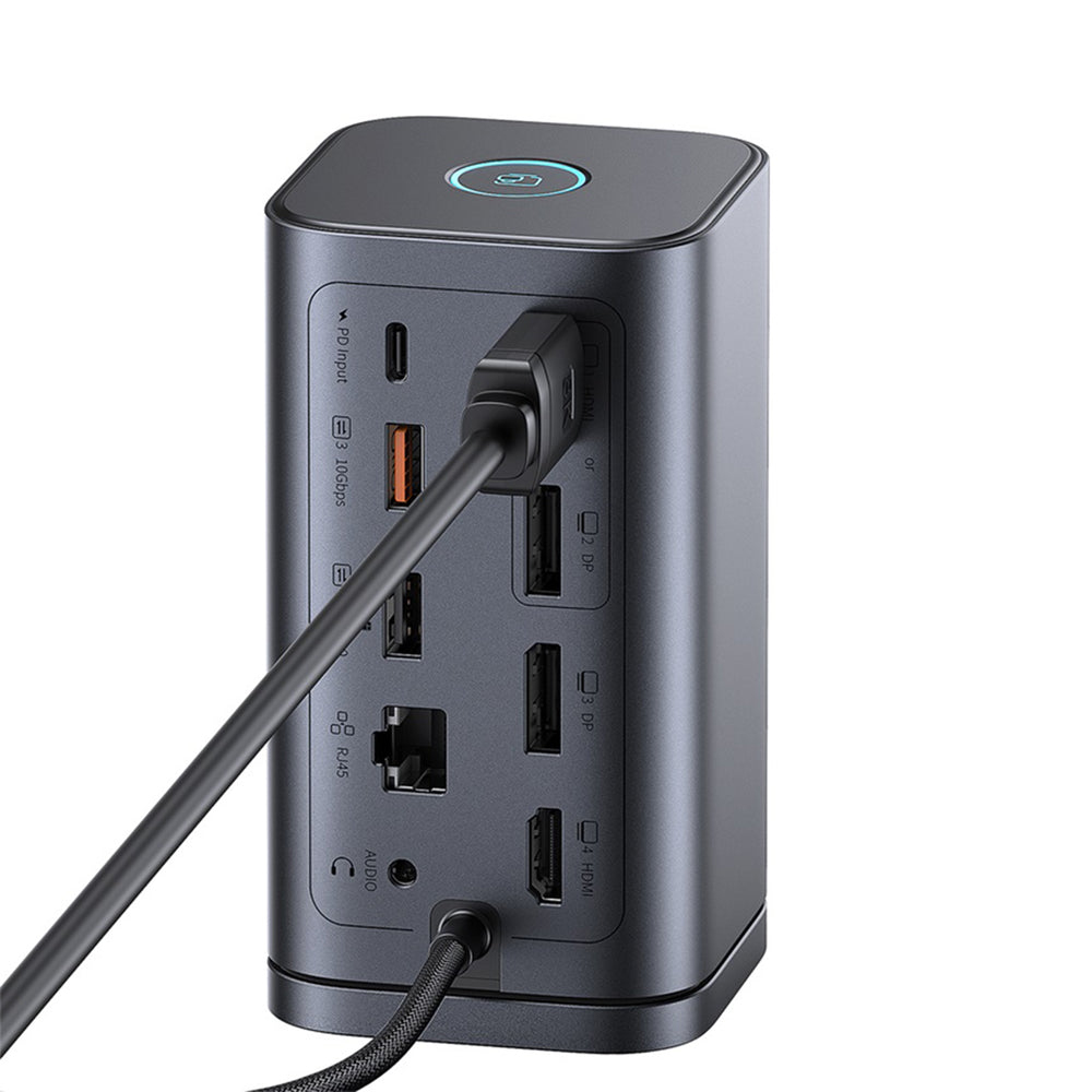 Grauer vertikaler USB-C-Hub mit mehreren Anschlüssen, angeschlossenen Kabeln und blauem leuchtenden Knopf oben.