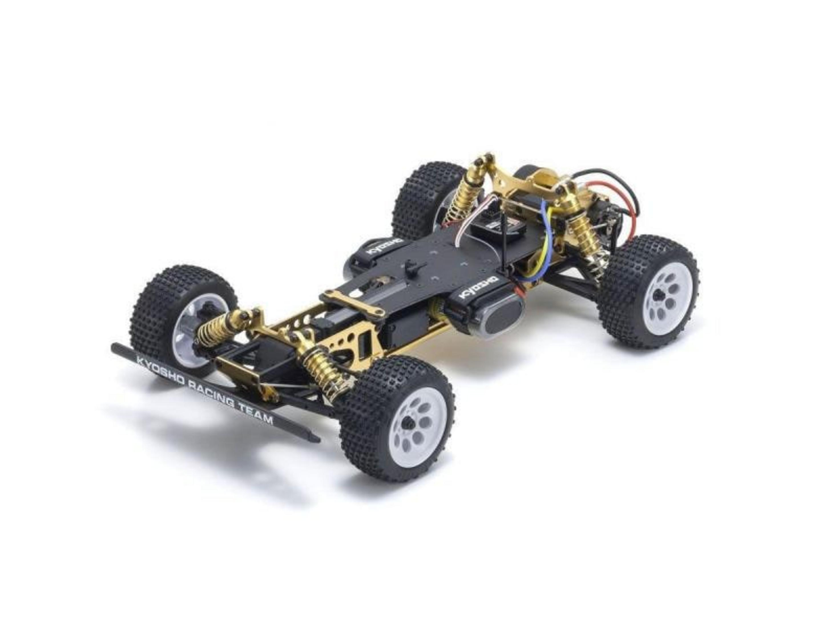 Ein RC-Buggy-Chassis mit goldnen Akzenten, schwarzen Reifen und einem schwarzen Frontbügel auf weißem Grund.