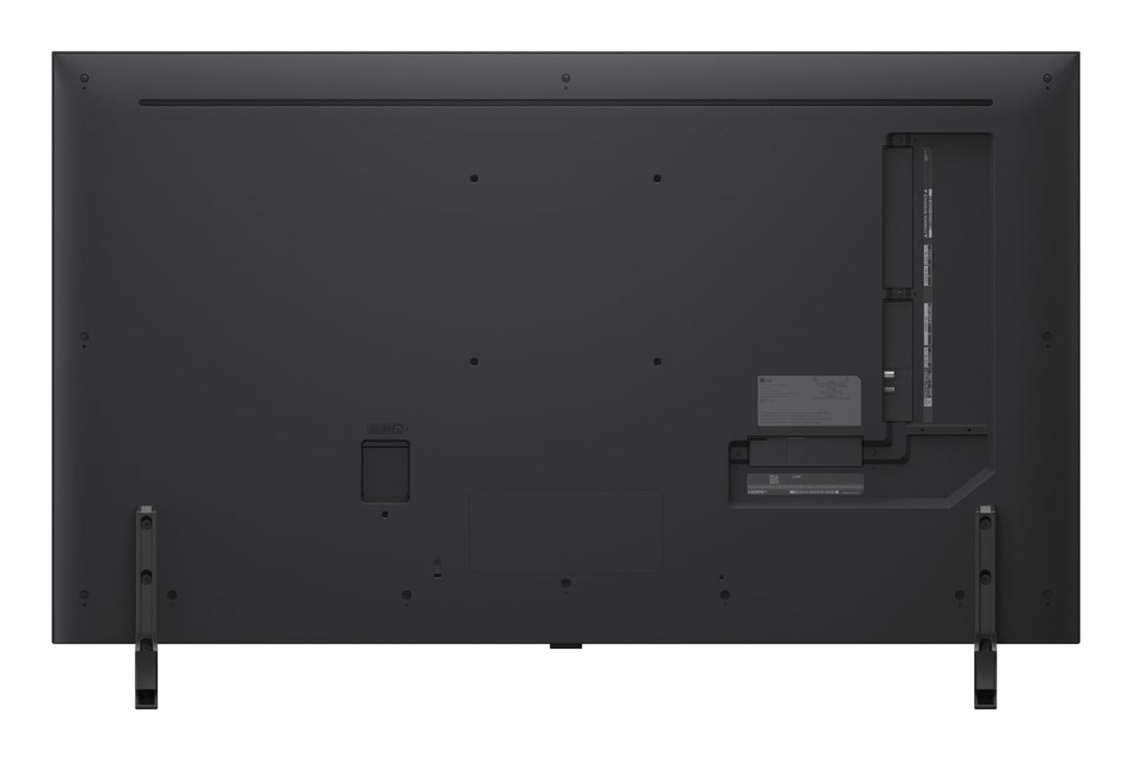 Vista trasera de un televisor negro con puertos de conexión a la derecha y dos soportes abajo.