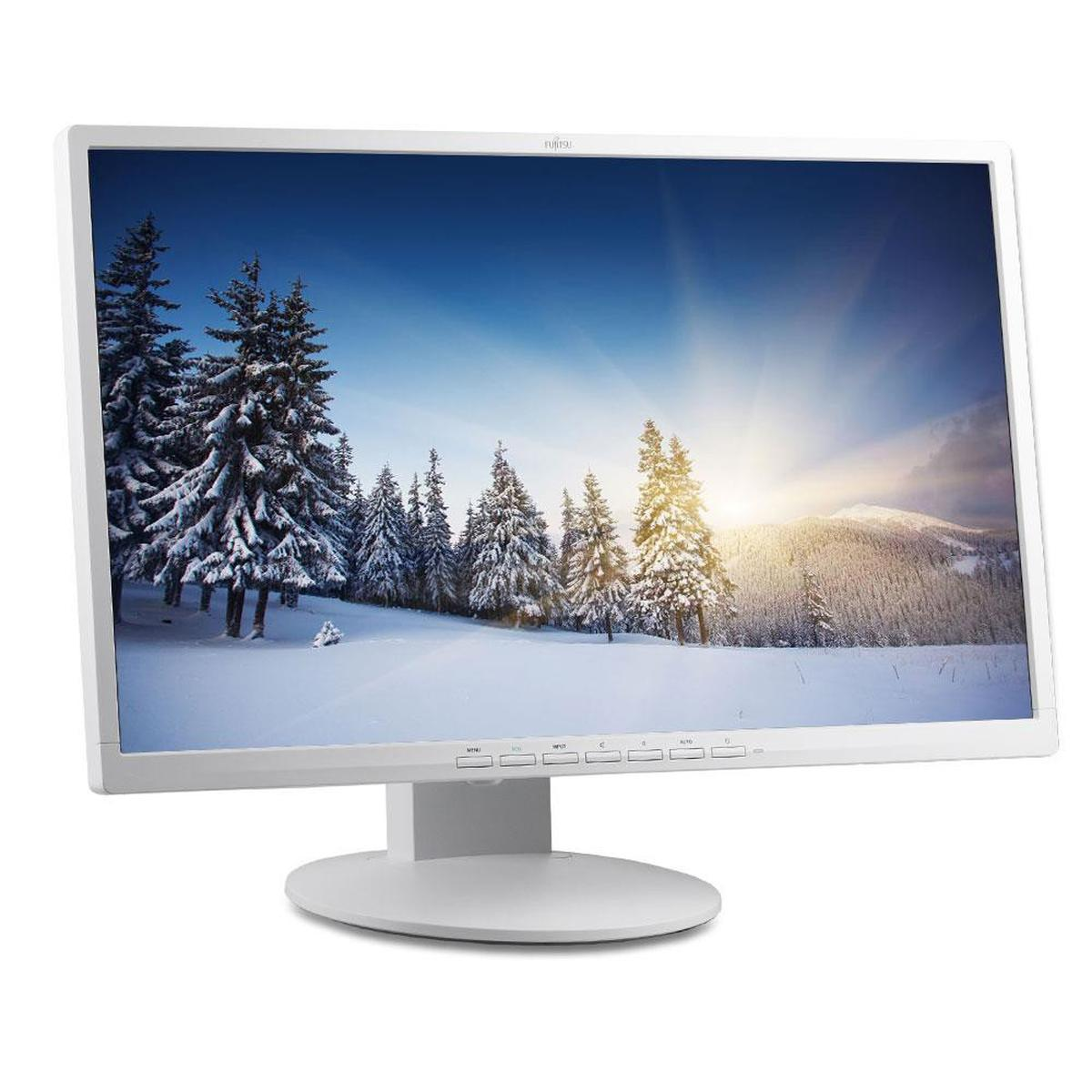Un monitor bianco Fujitsu mostra un paesaggio invernale innevicato con abeti e luce solare.