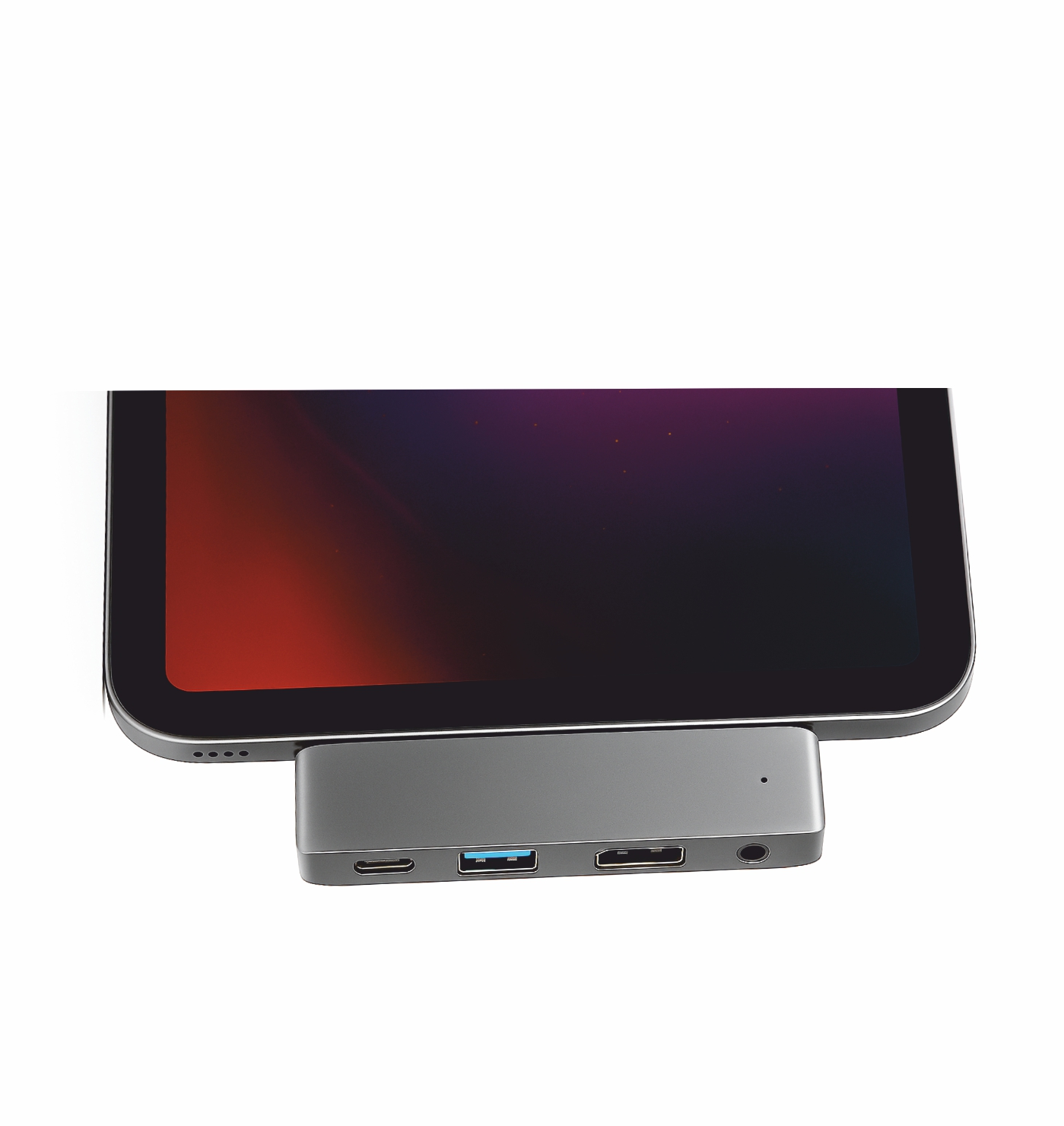 Un concentrador USB-C gris de varios puertos está conectado a una tableta con una pantalla roja y negra.