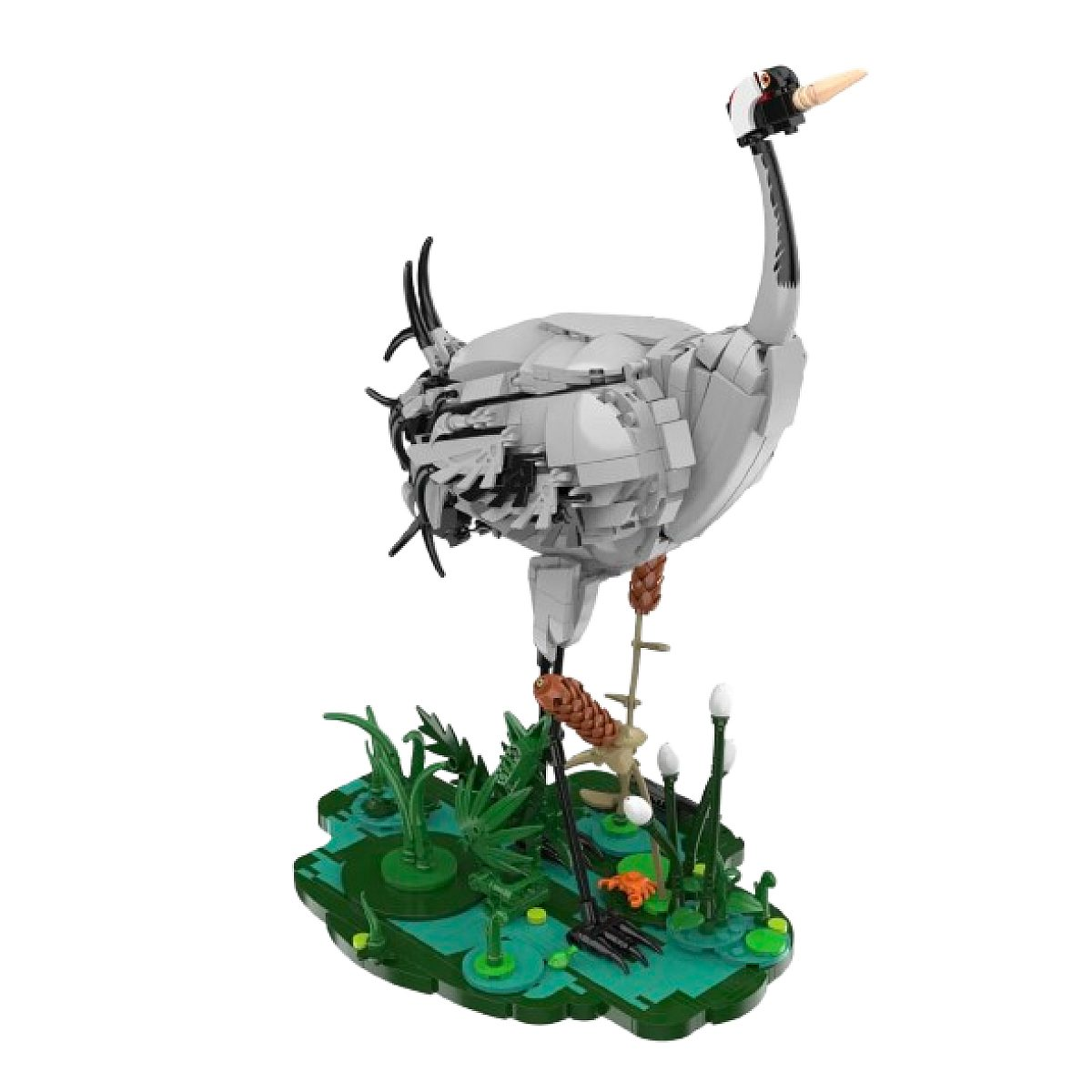 Ein Lego-Kranich steht auf einer grünen, von Pflanzen und Gewässern umgebenen Base.