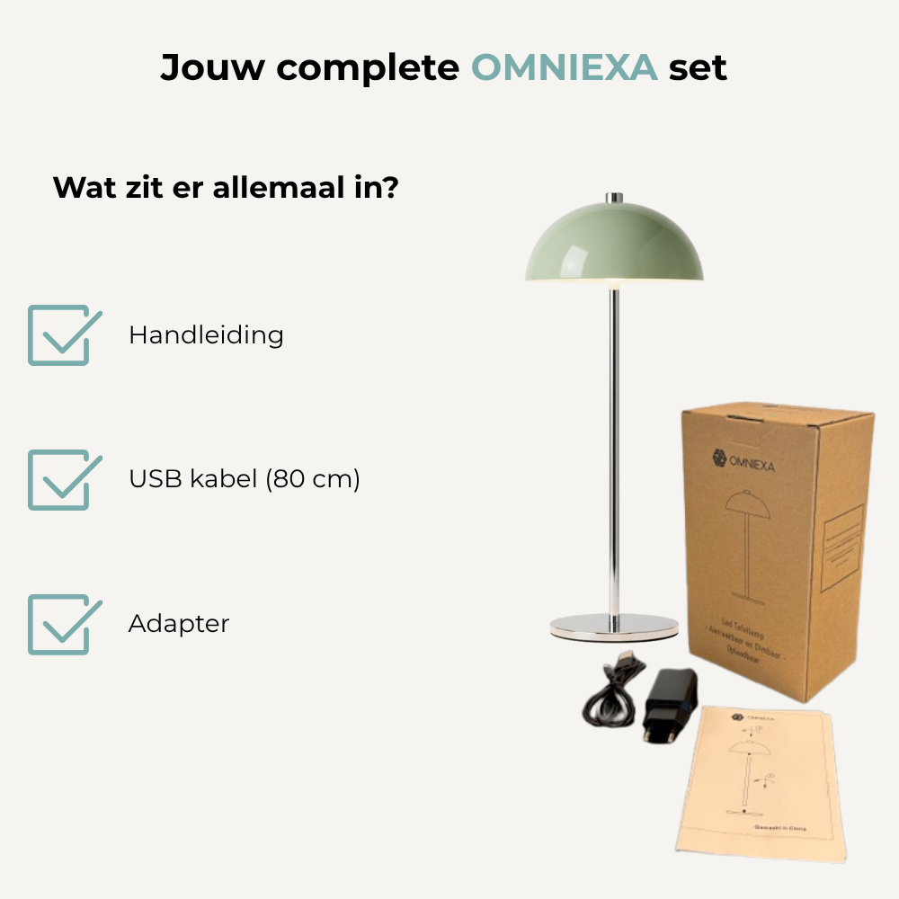 Omniexa set met groene tafellamp, doos, USB-kabel, adapter en handleiding.