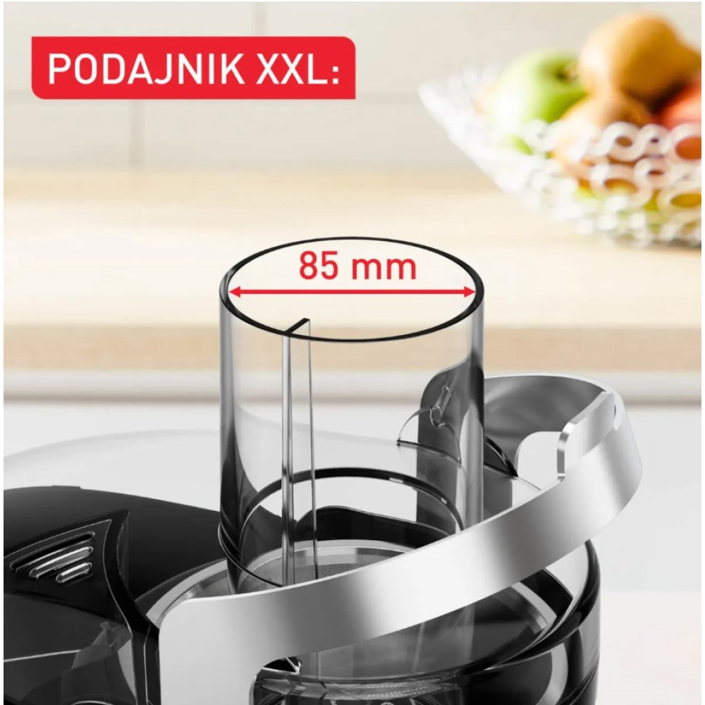 Zbliżenie na otwór wsadowy sokowirówki o średnicy 85 mm w kuchni.