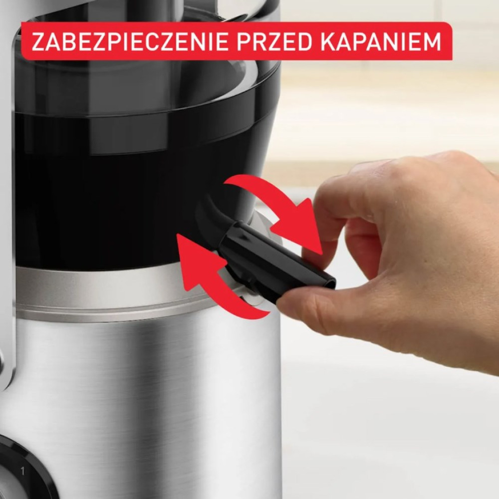 Ręka obsługuje wylewkę sokowirówki z blokadą kapania.