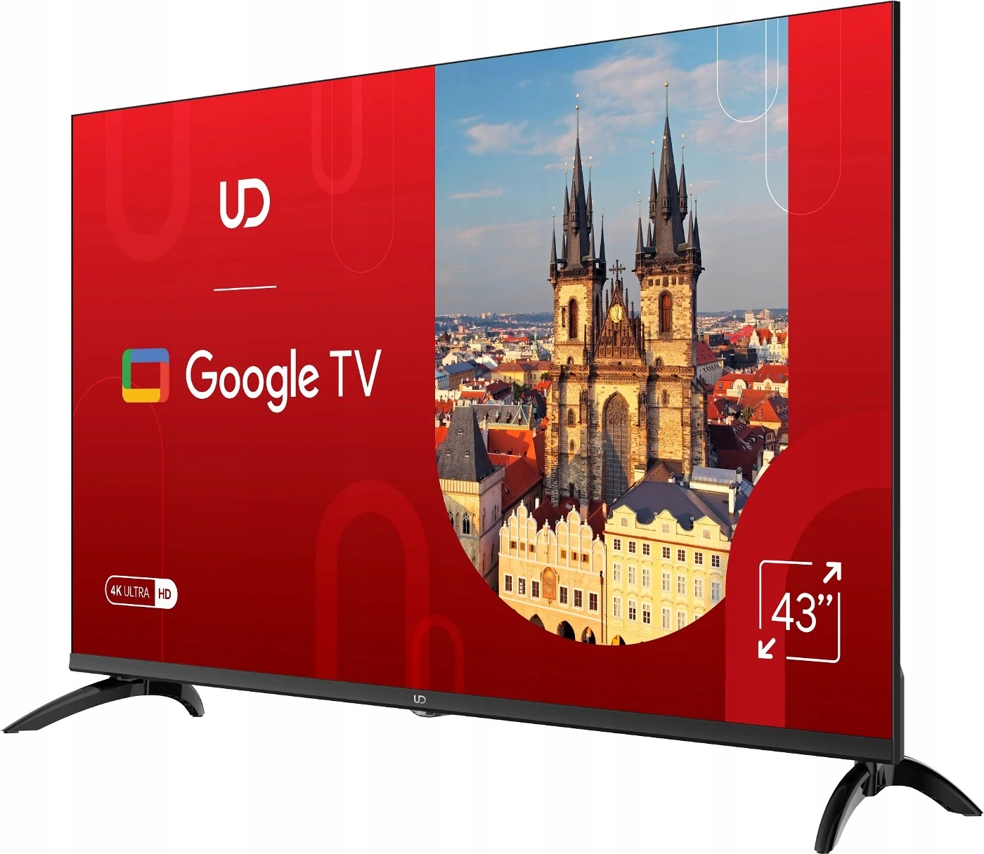 43-calowy ekran Google TV przedstawia europejskie miasto, otoczony czerwonym tłem z logo.