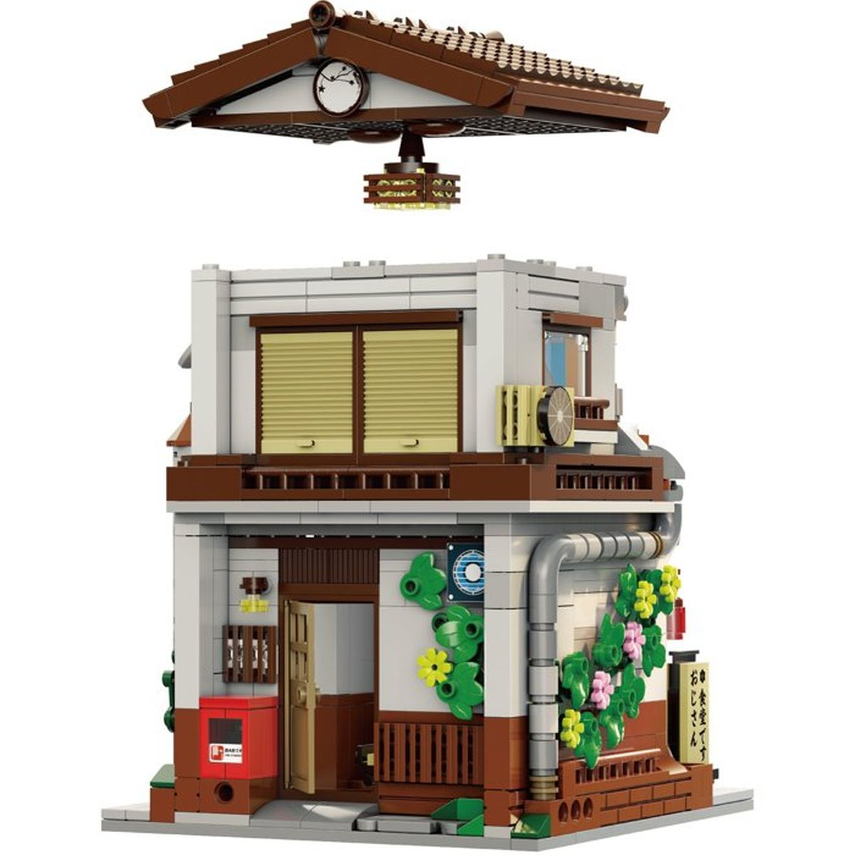 Ein Lego-Modell eines japanischen Gebäudes mit Blumen, offener Tür und abnehmbarem Dach.