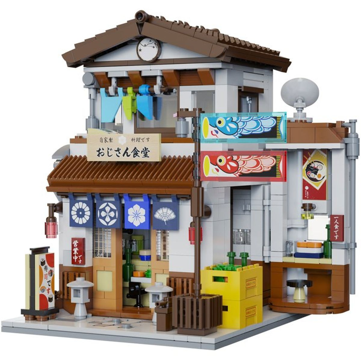Ein detailreiches LEGO-Modell eines japanischen Restaurants mit blauen Vorhängen, Schildern und gelben Kisten davor.