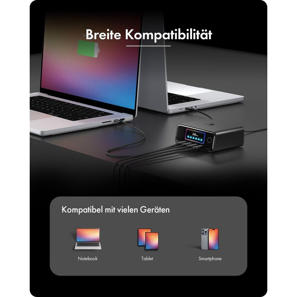 Ladestation mit digitalen Display verbindet mehrere Laptops und Geräte auf einem Tisch.