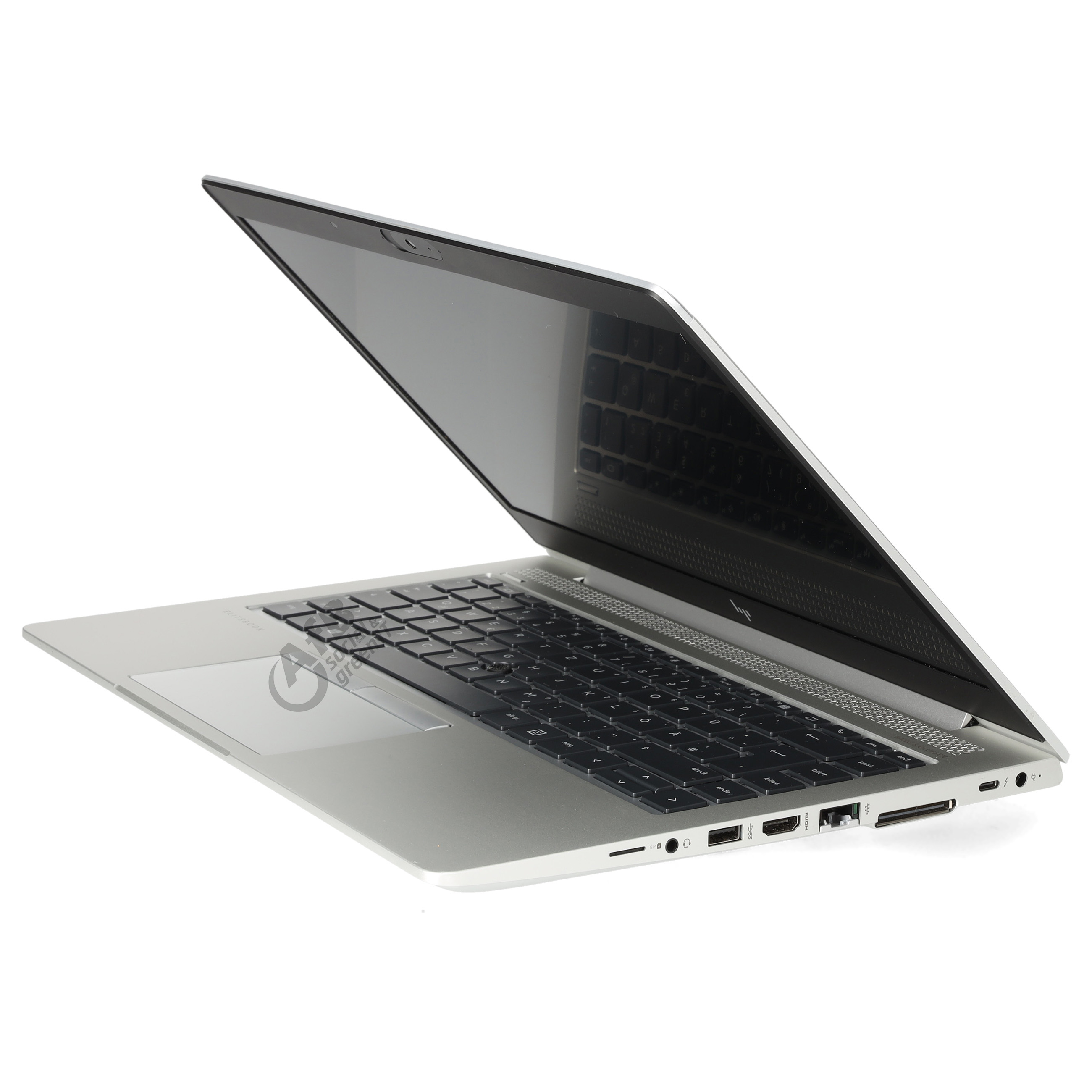 Silberner Laptop im Profil auf weißem Hintergrund, mit Tastatur und Anschlüssen.