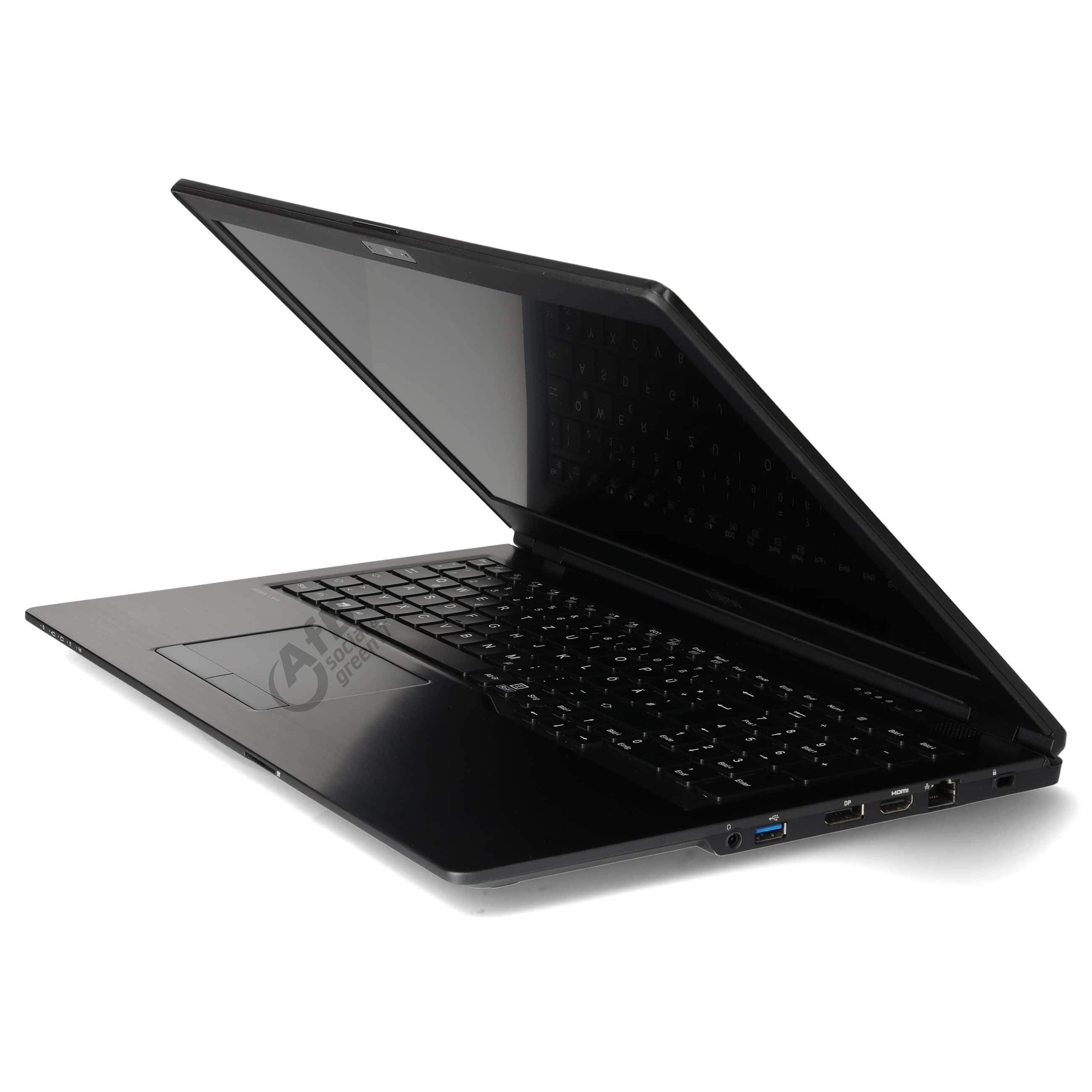 Ein offener schwarzer Laptop steht auf einer weissen Oberflaeche, seitlich fotografiert.