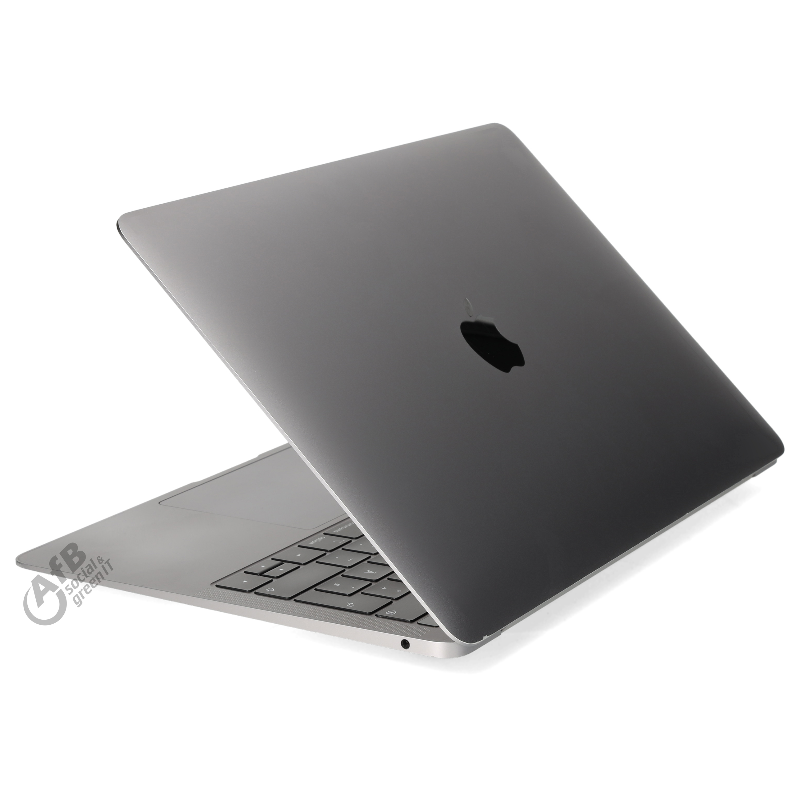 Ein grauer Laptop mit Apple-Logo ist auf einer weißen Oberfläche halb geöffnet und von schräg oben zu sehen.