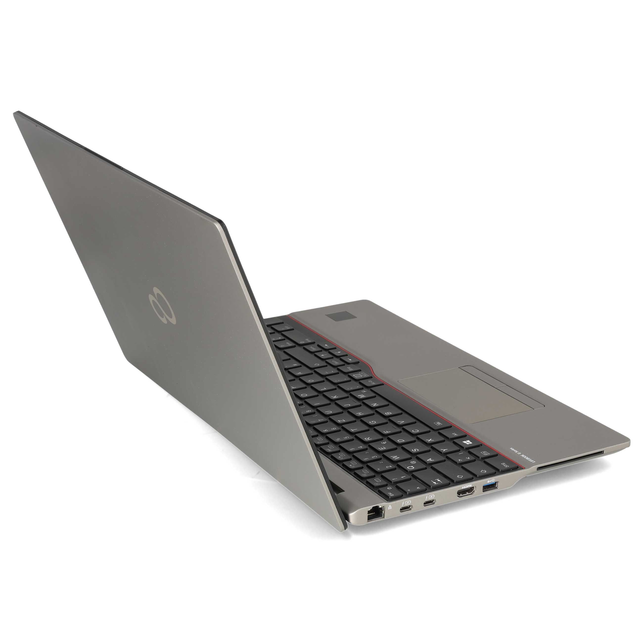 Ein grauer Laptop steht offen auf einer weißen Oberfläche, die Tastatur und Anschlüsse an der Seite sind sichtbar.