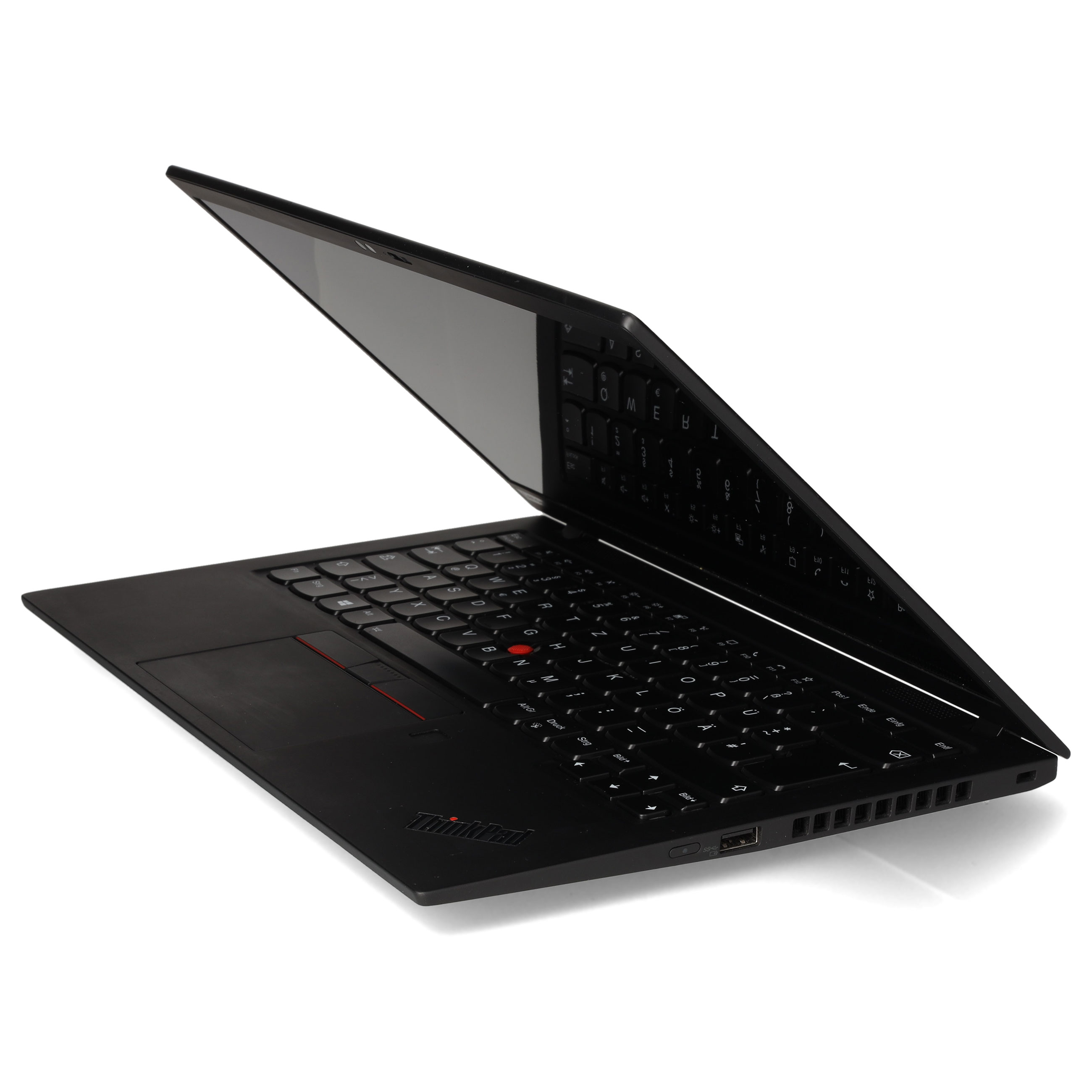 Ein schwarzer Laptop steht leicht geöffnet auf einer weißen Oberfläche vor hellem Hintergrund.