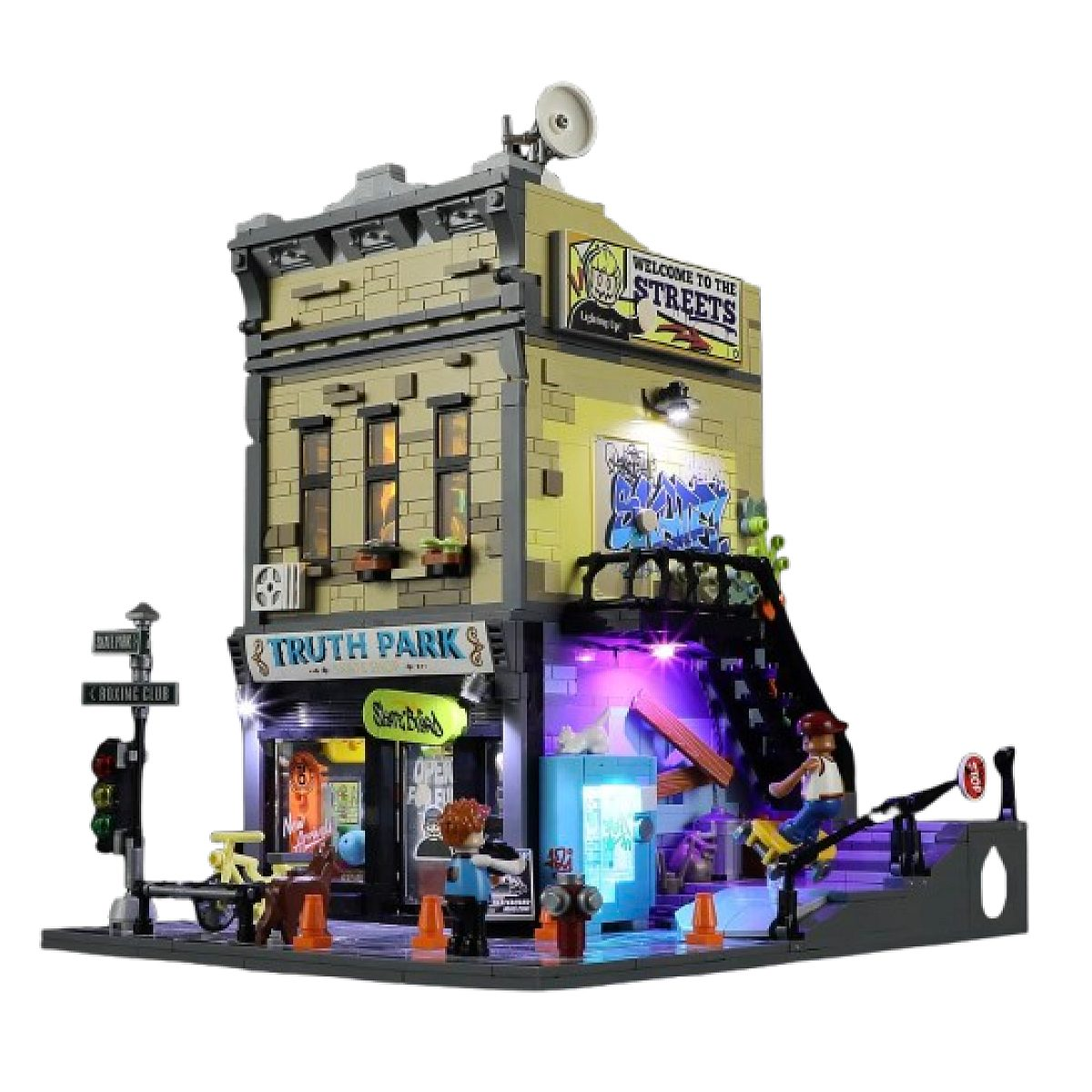 Eine beleuchtete Lego-Straßenszene mit zwei Minifiguren, Graffiti, Treppen, einem Vending-Automat und Straßenschildern.