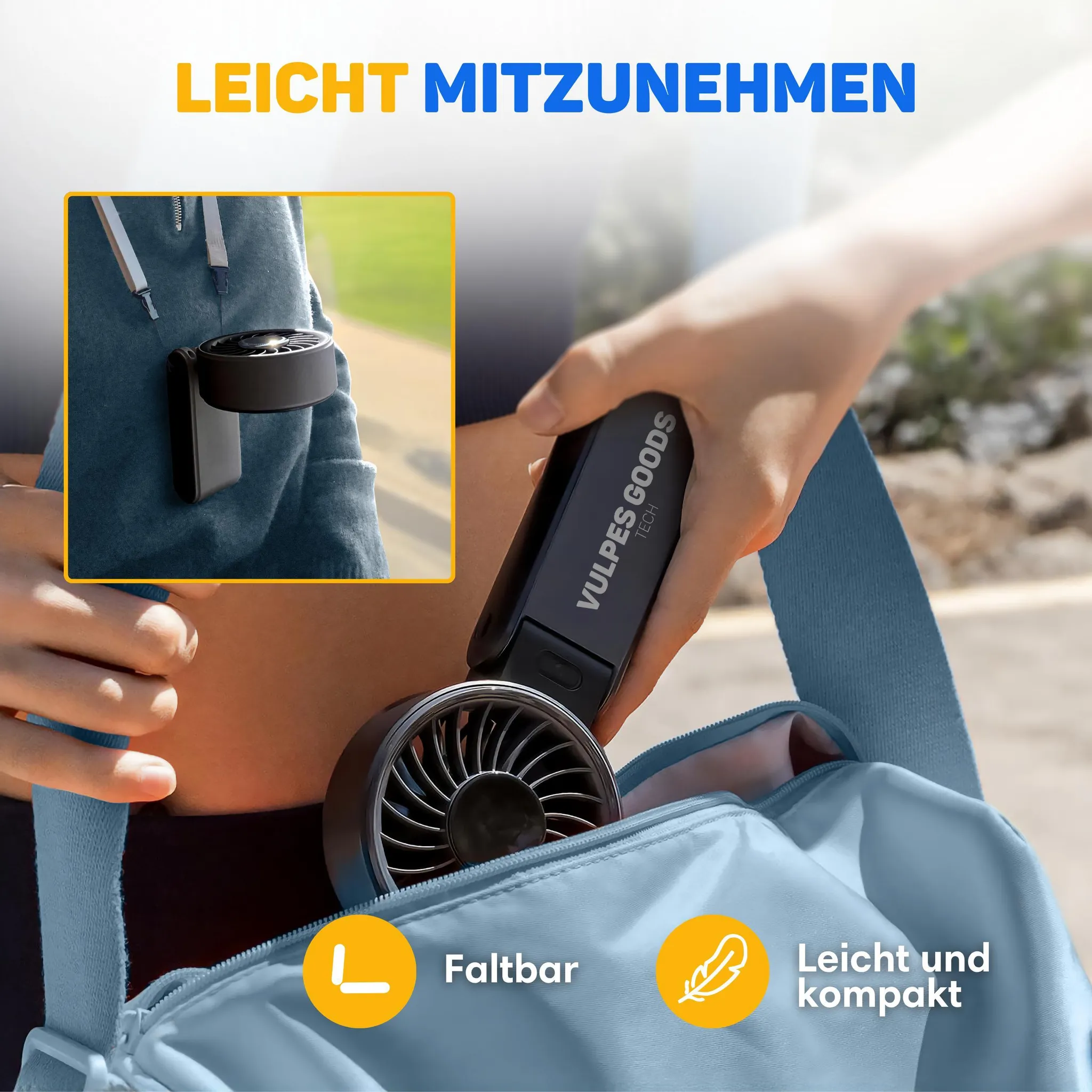 Hand hält einen tragbaren, schwarzen Vulpes Goods Handventilator, der in eine blaue Tasche gesteckt wird.