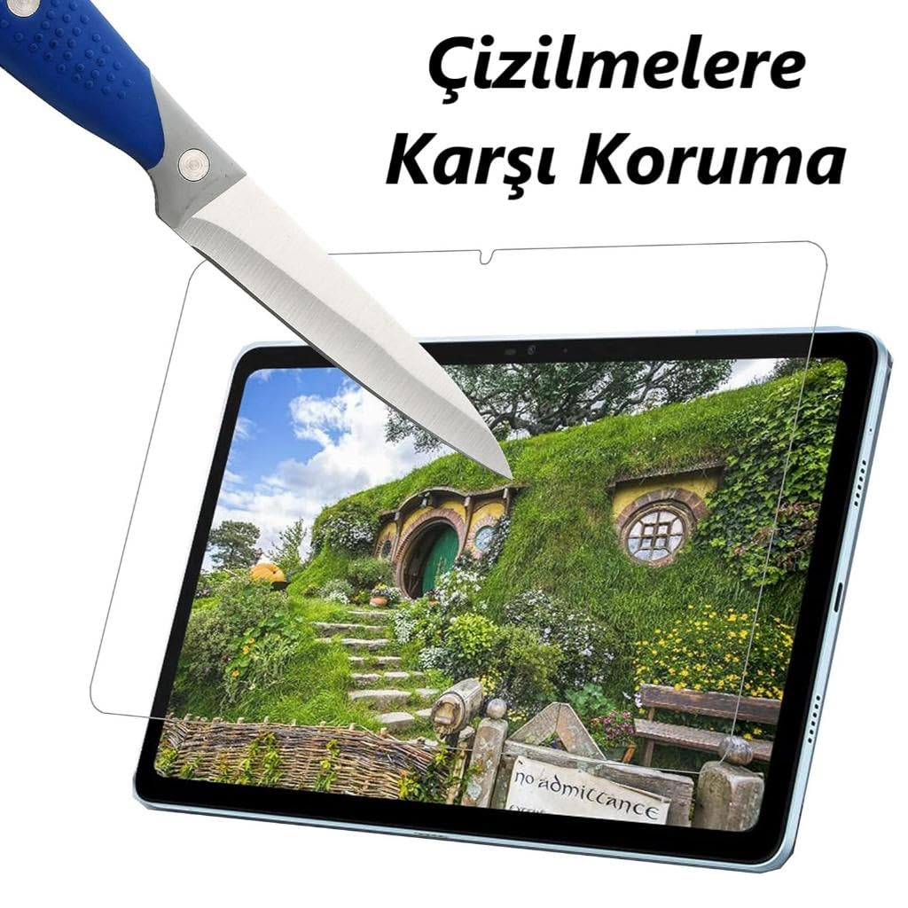 Bir bıçak, manzara resmi gösteren bir tabletteki ekran koruyucusunu çiziyor.