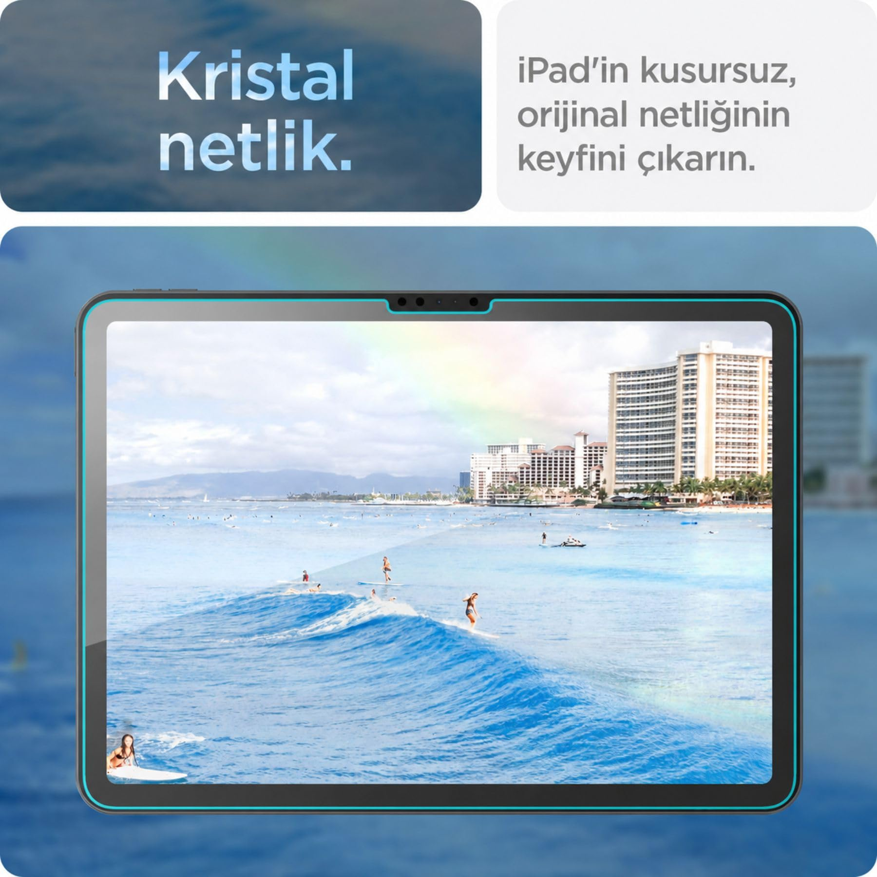Bir tablet, arka planda binalarla birlikte dalgalarda sörf yapan insanların net bir görüntüsünü gösteriyor.