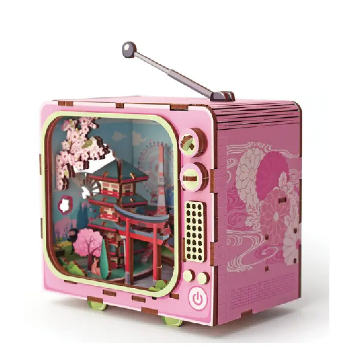 Ein rosa Retro-Spielzeug-TV-Diorama zeigt eine japanische Pagodenszene mit Kirschblüten.
