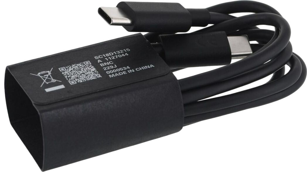 A black USB-C cable and power adapter with printed text on a white background.