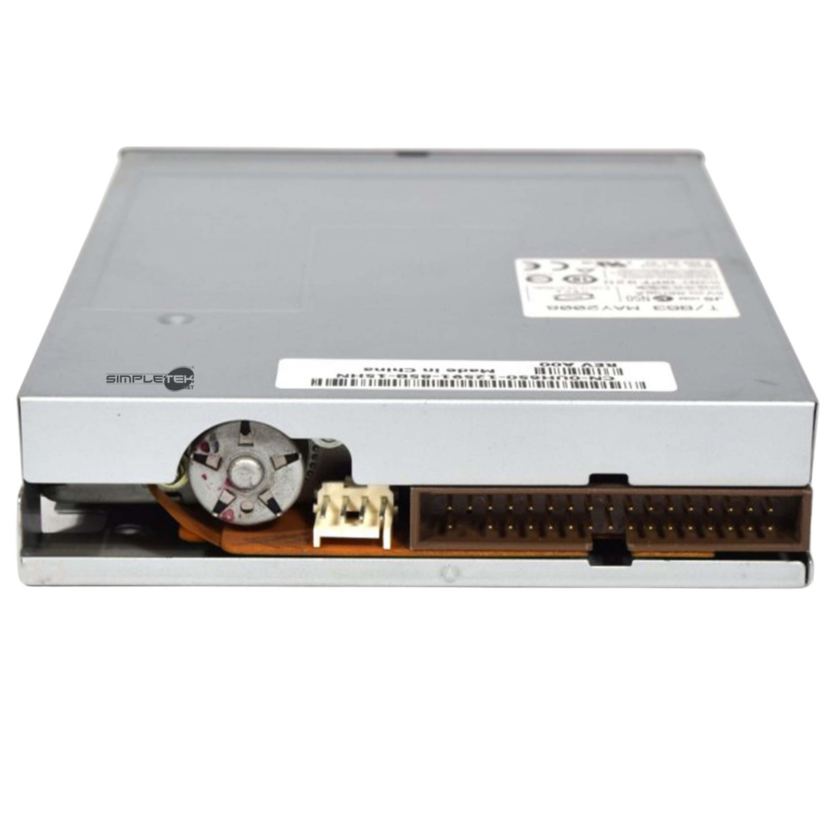 Vista inferiore di un lettore floppy disk argento con connettori e motore rotondo.