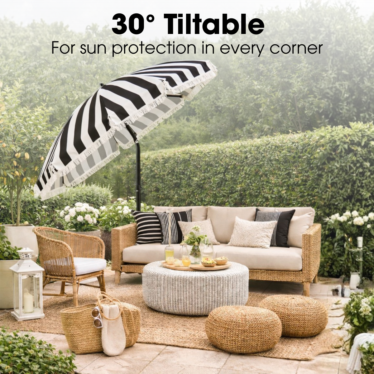Black and white striped patio umbrella over outdoor lounge furniture.