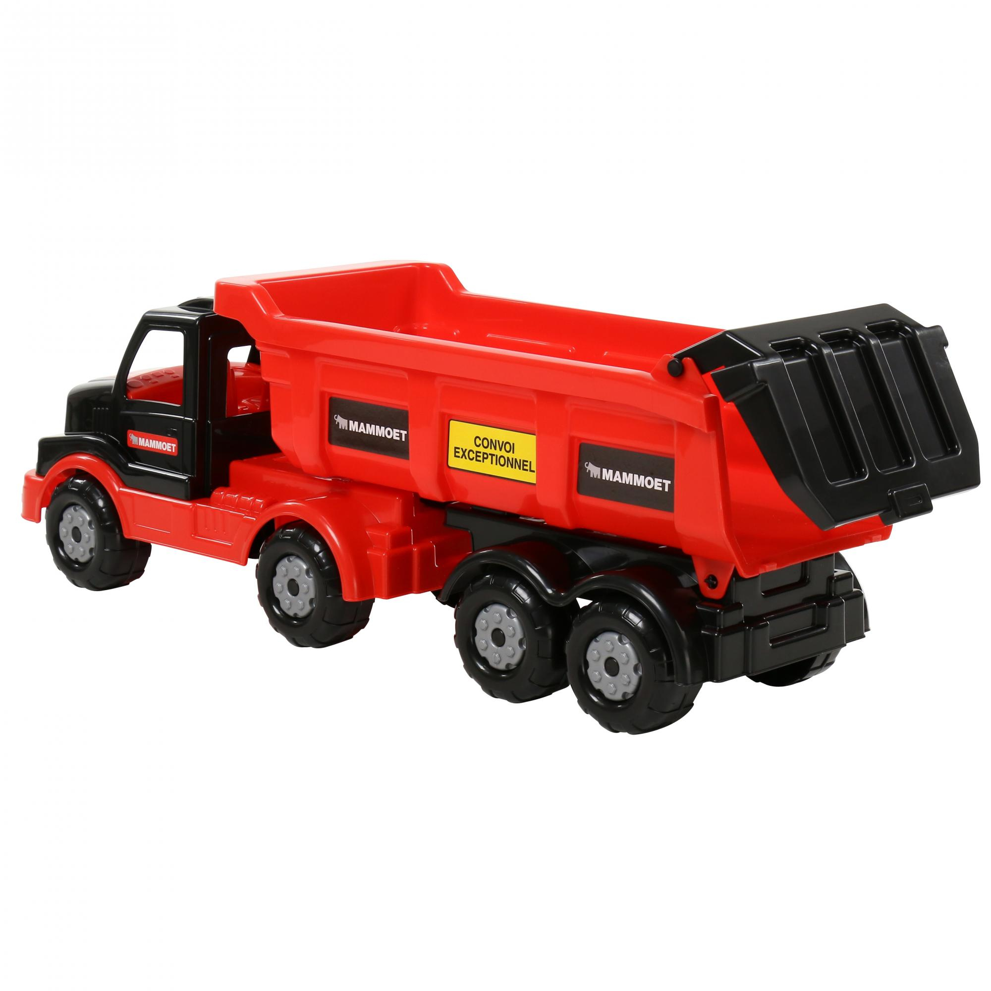 Un camión volquete de juguete rojo y negro con múltiples ruedas, logotipos de Mammoet y un cartel amarillo Convoi Exceptionnel.