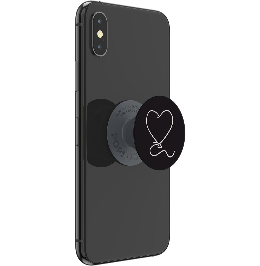 Ein schwarzes Smartphone mit vertikaler Dual-Kamera hat einen schwarzen PopGrip mit einer weißen Herz-Luftballon-Grafik auf der Rückseite.